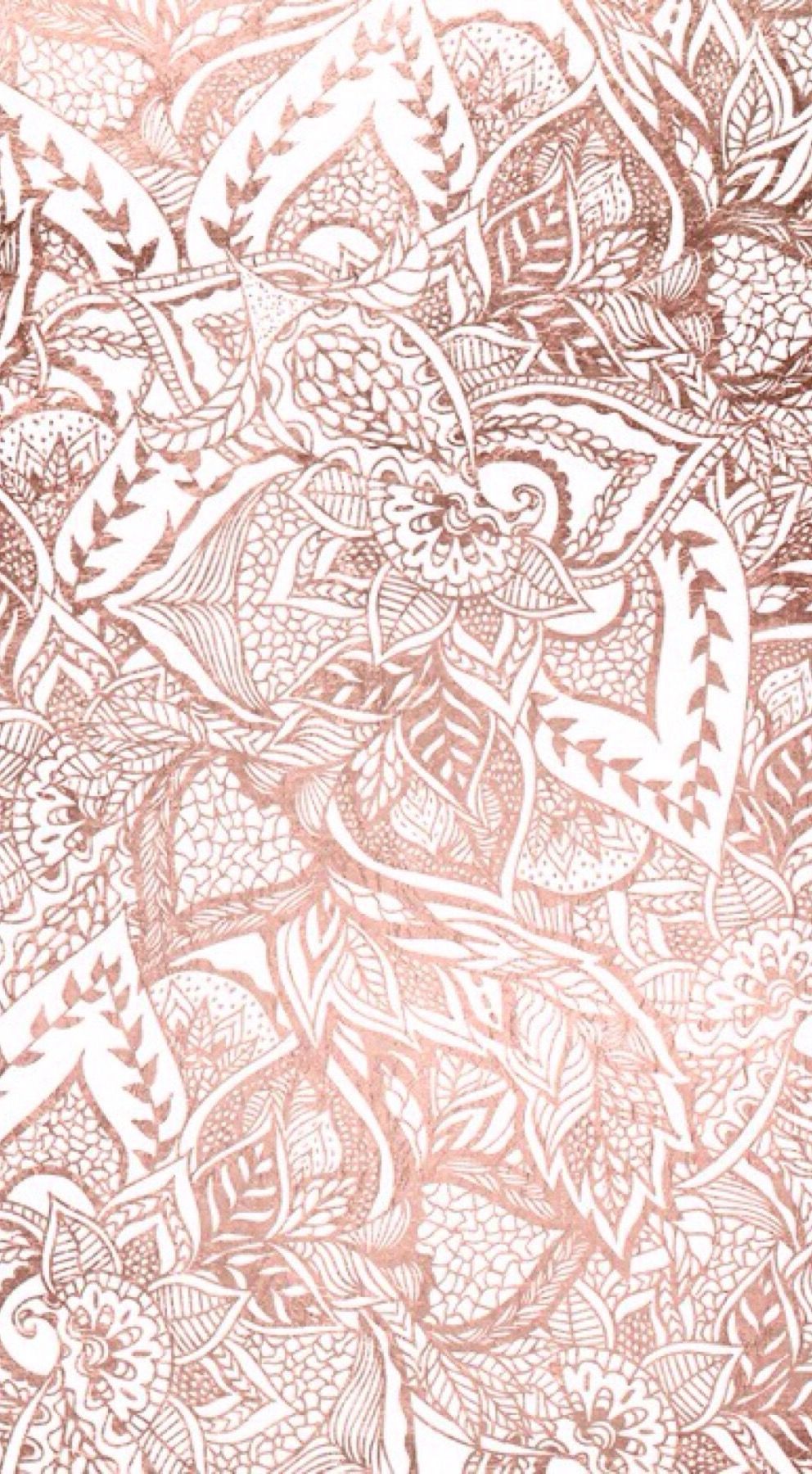 A close up of an ornate pattern in copper - Rose gold