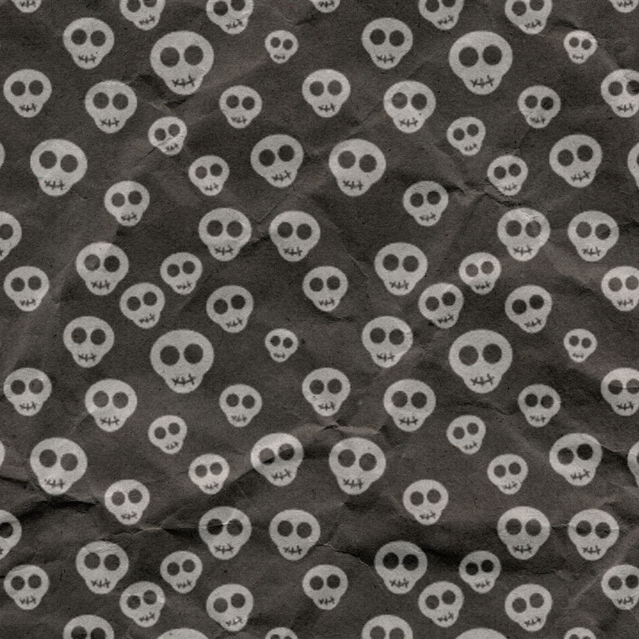 A seamless pattern of skulls on black paper - Skull