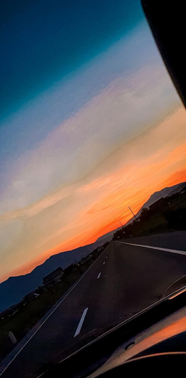 A beautiful sunset over a mountain road - Sunrise