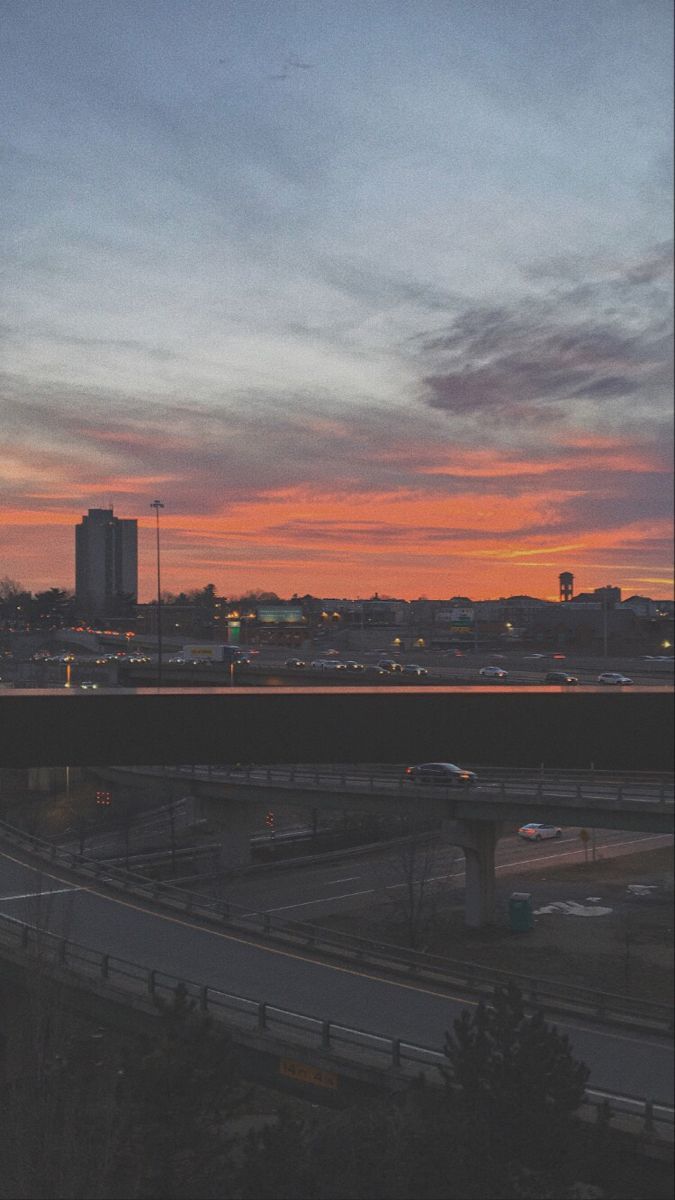 A sunset over an interstate highway - Sunrise