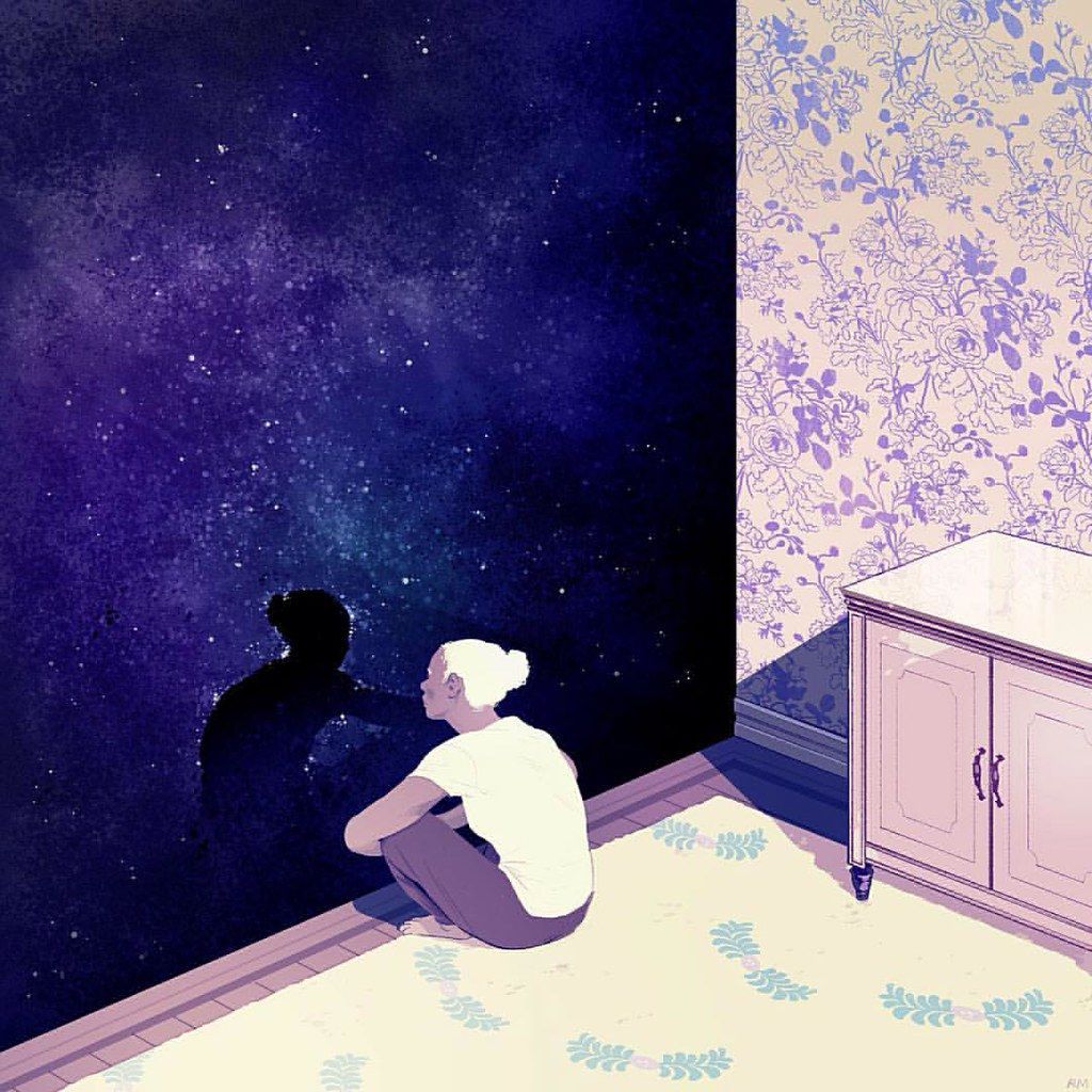 A person sits on the floor in a room, looking out at the night sky. - Spiritual