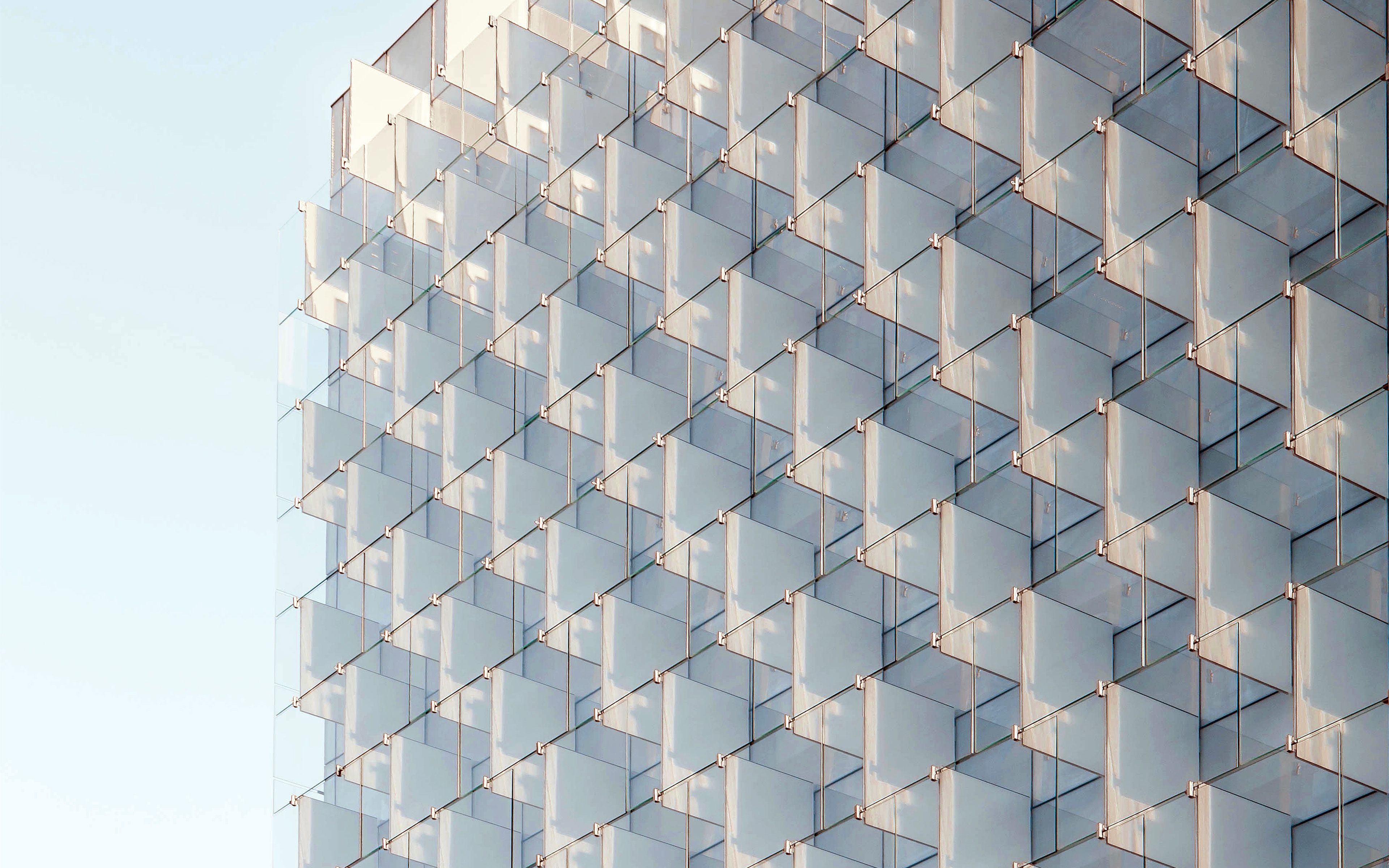 A building with glass windows and a sky background - Architecture