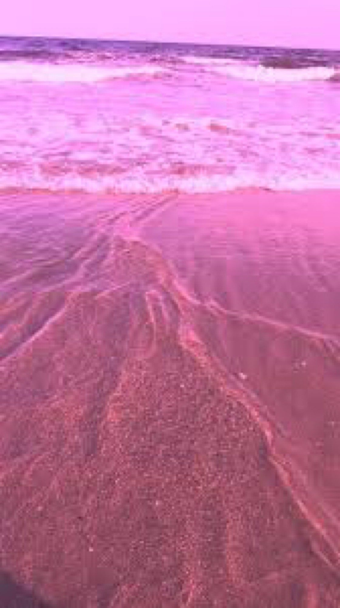 A pink beach with waves and sand - Beach