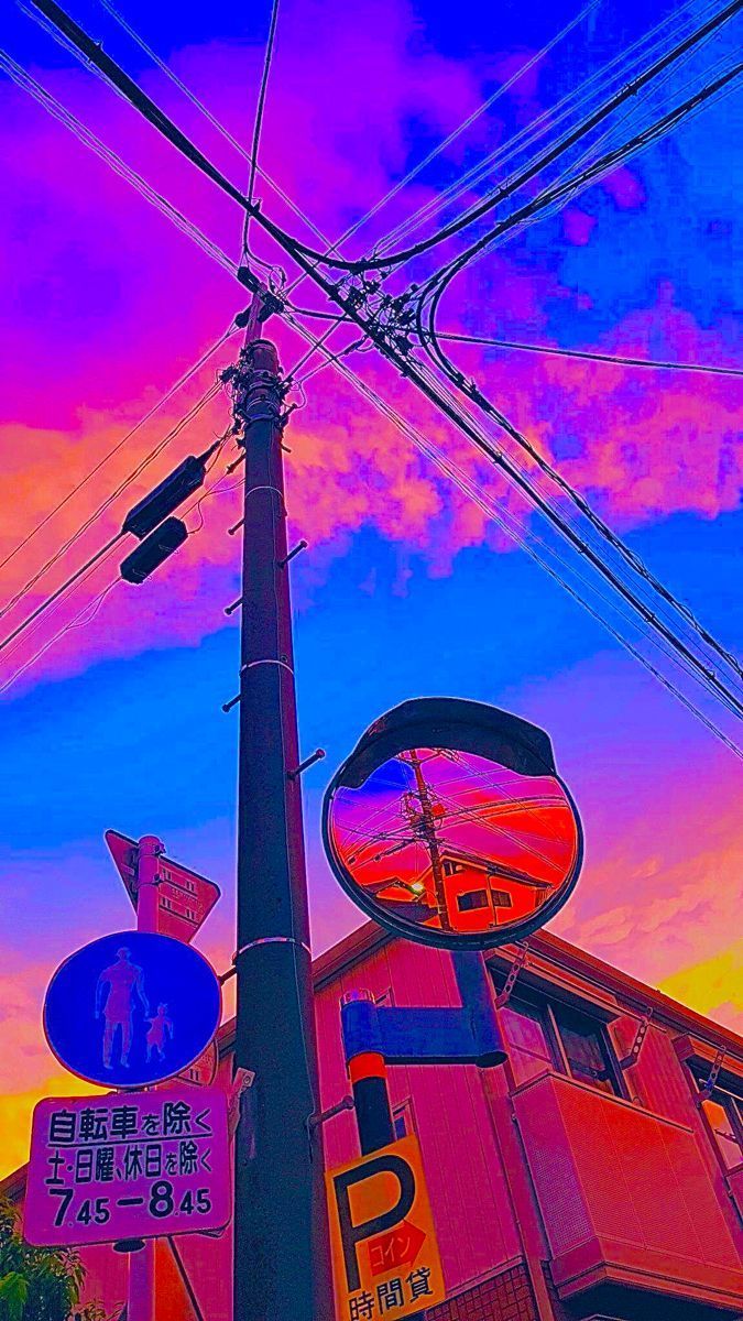 A colorful sky and street signs in Japan - Indie