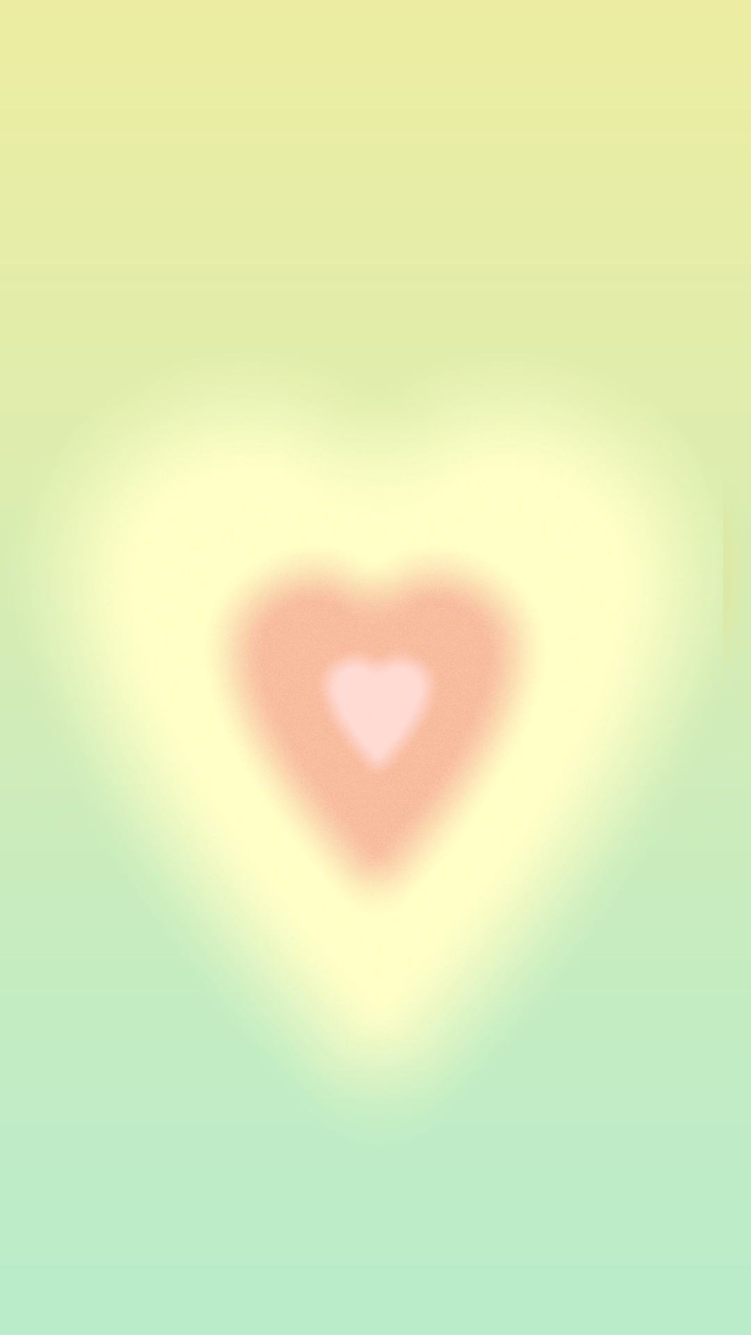 A heart shape in the middle of a blurred image - Sage green