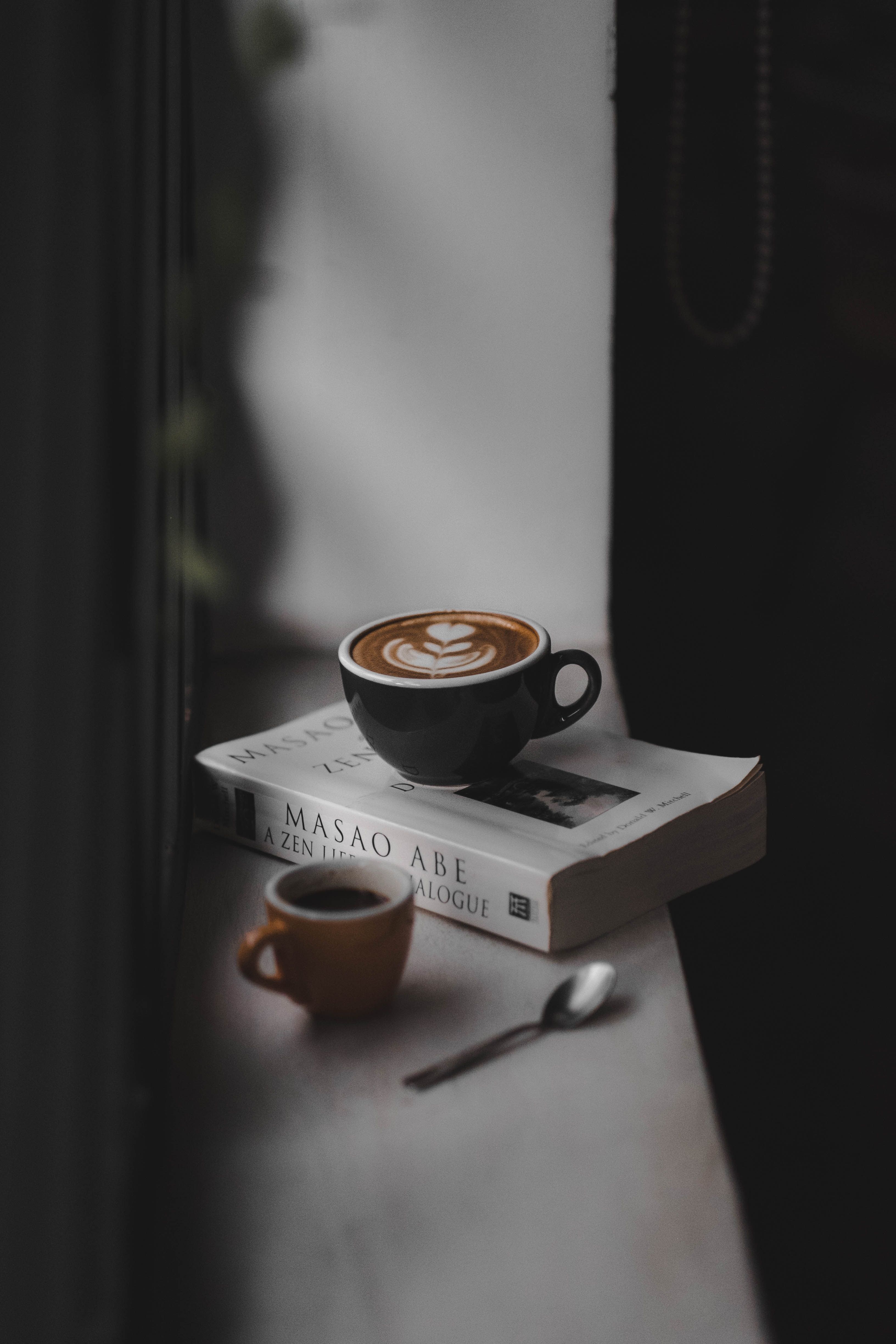 A cup of coffee on top of a book. - Coffee, study