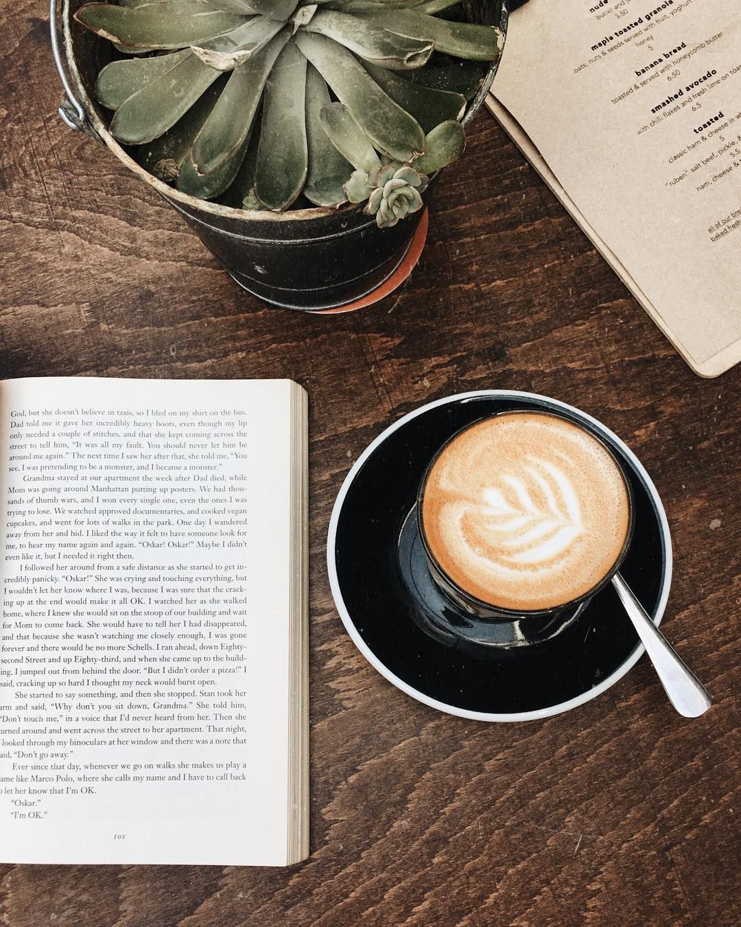 A cozy day in with a good book, latte, and succulent. - Coffee