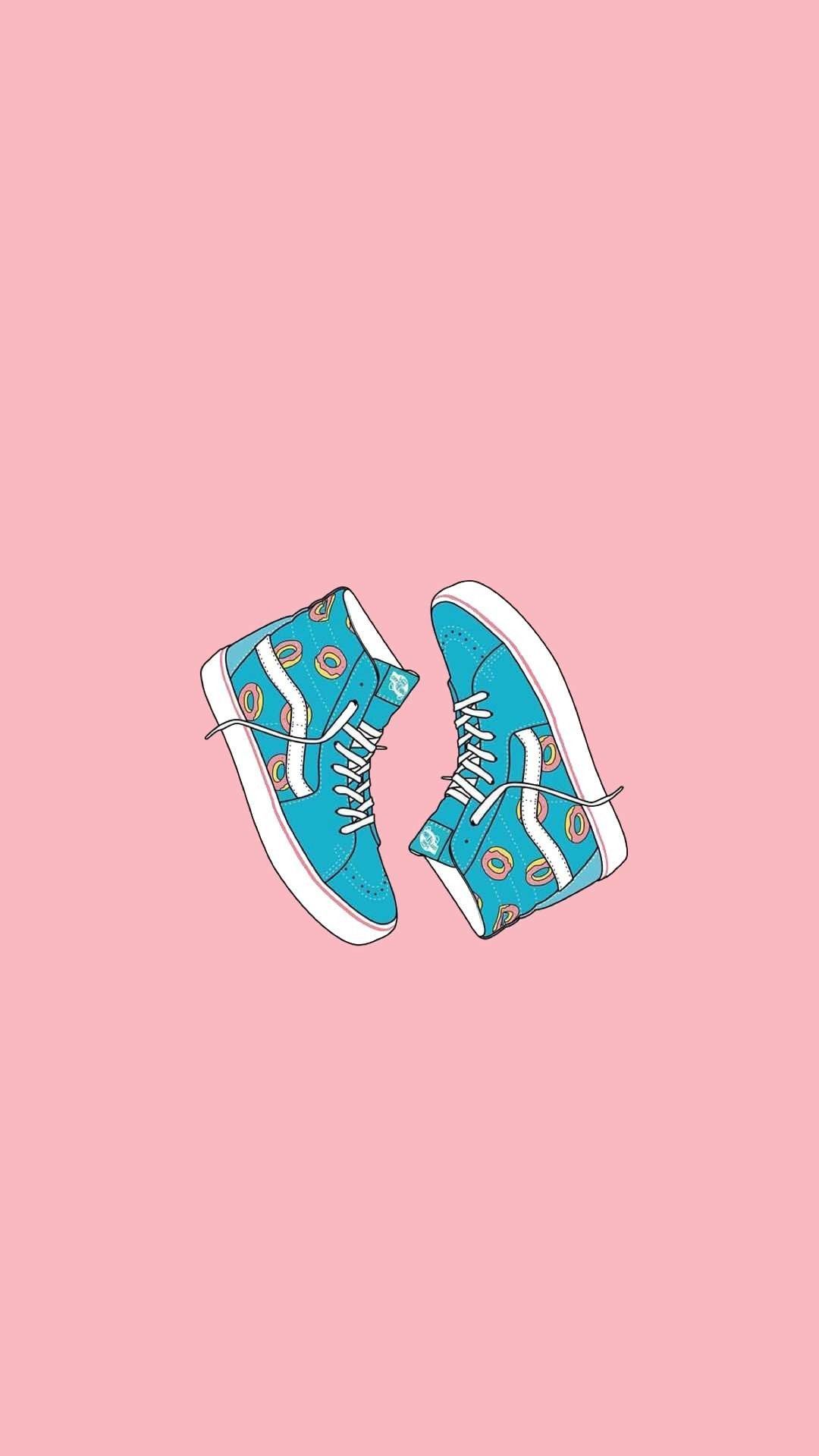 A pair of blue sneakers on pink background - Shoes