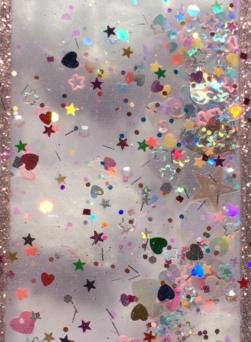 A close up of an iphone case with glitter - Glitter