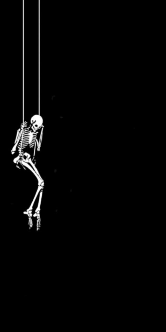 A skeleton hanging from a rope. - Skeleton