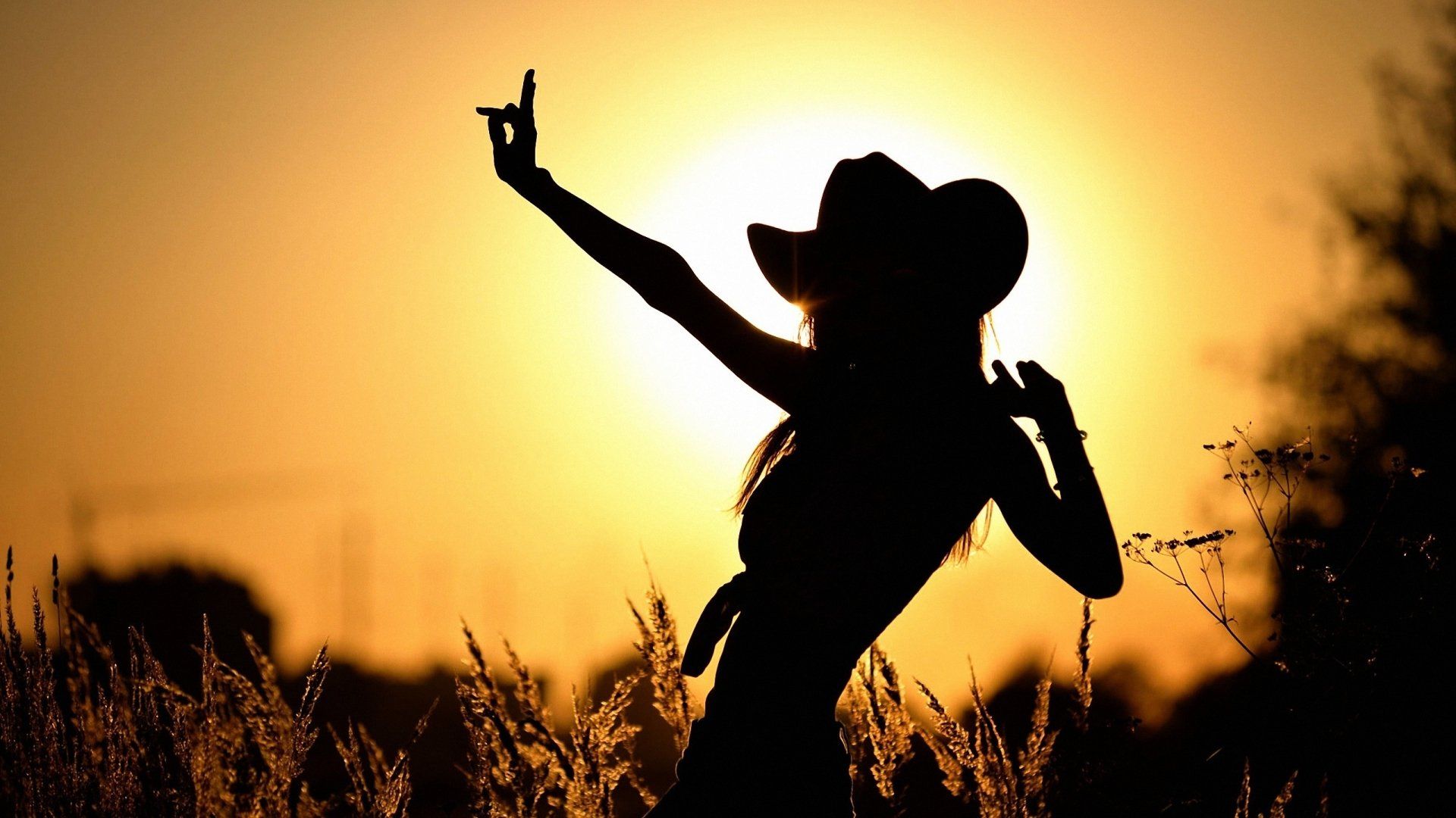 Silhouette of a woman in a cowboy hat - Cowgirl