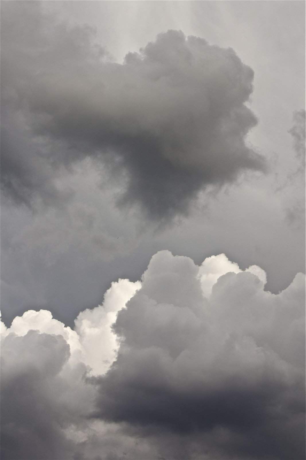A dark and brooding sky with large clouds - Gray