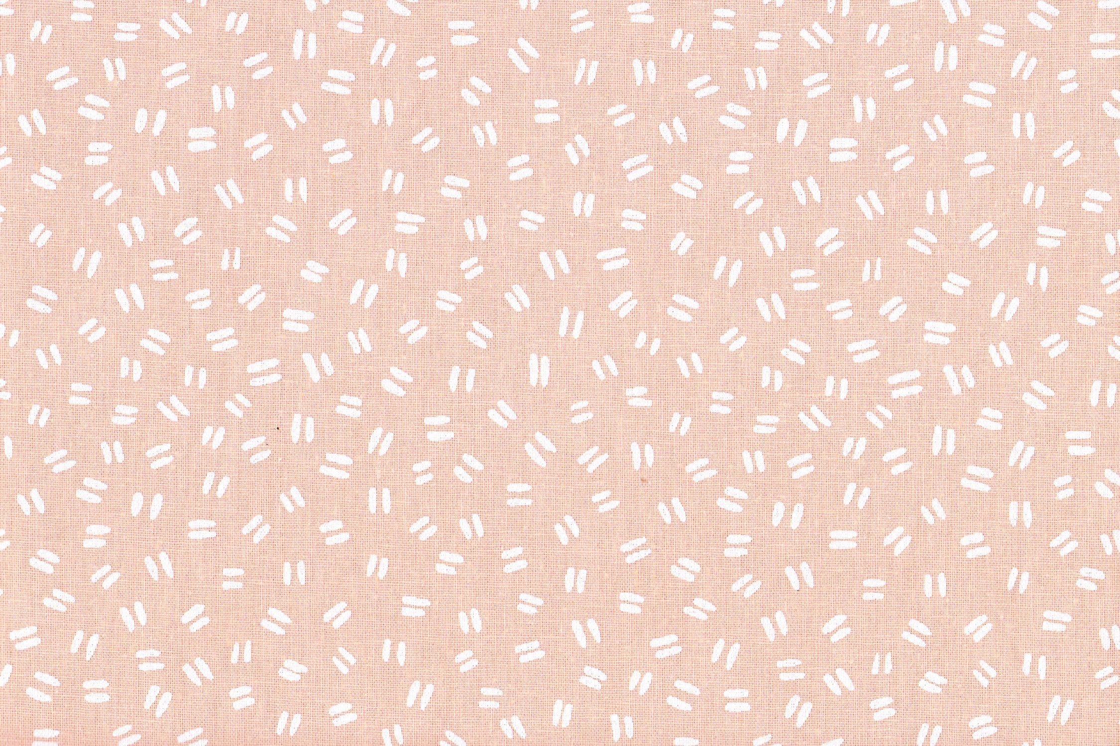 A peach colored fabric with white painted dashes - Peach