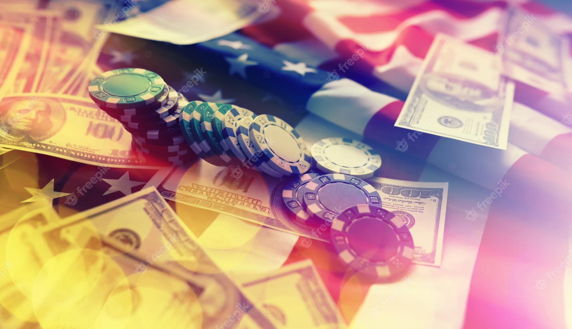 A stack of money and poker chips on an american flag - Money