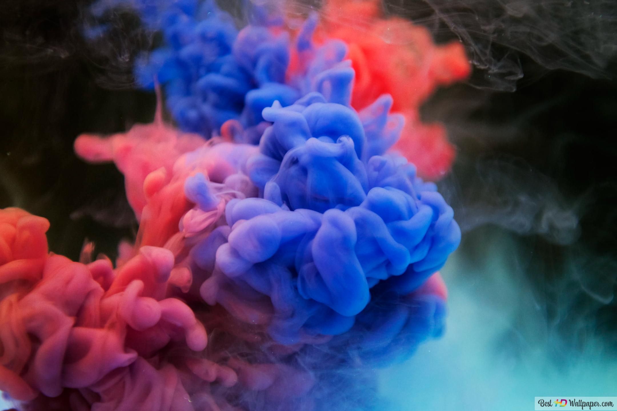 A close up of two blue and red liquids - Smoke