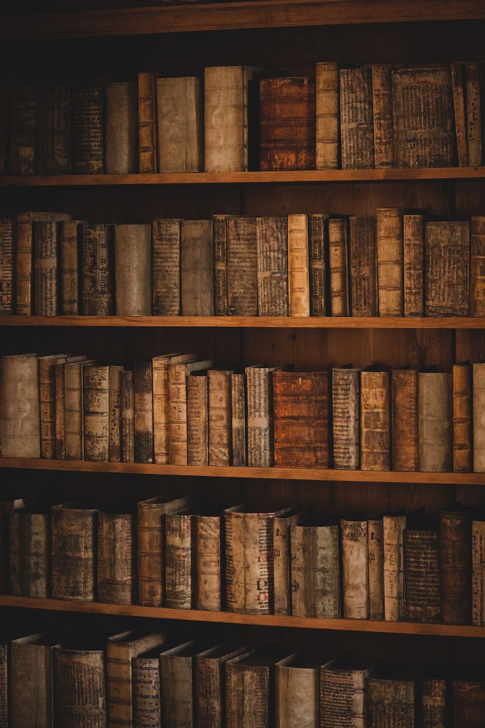 A book shelf with many books on it - Library