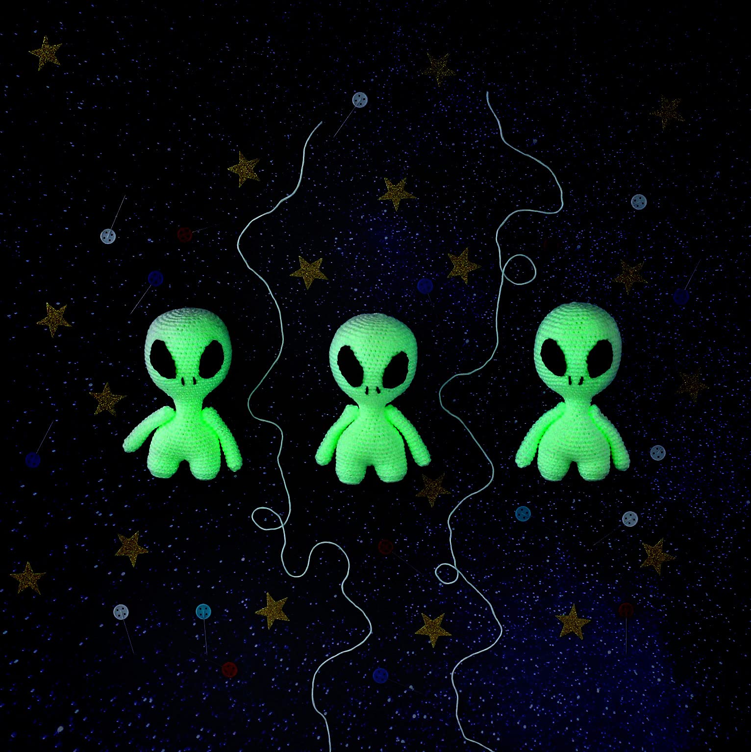 3 green crochet aliens on a starry background - Alien