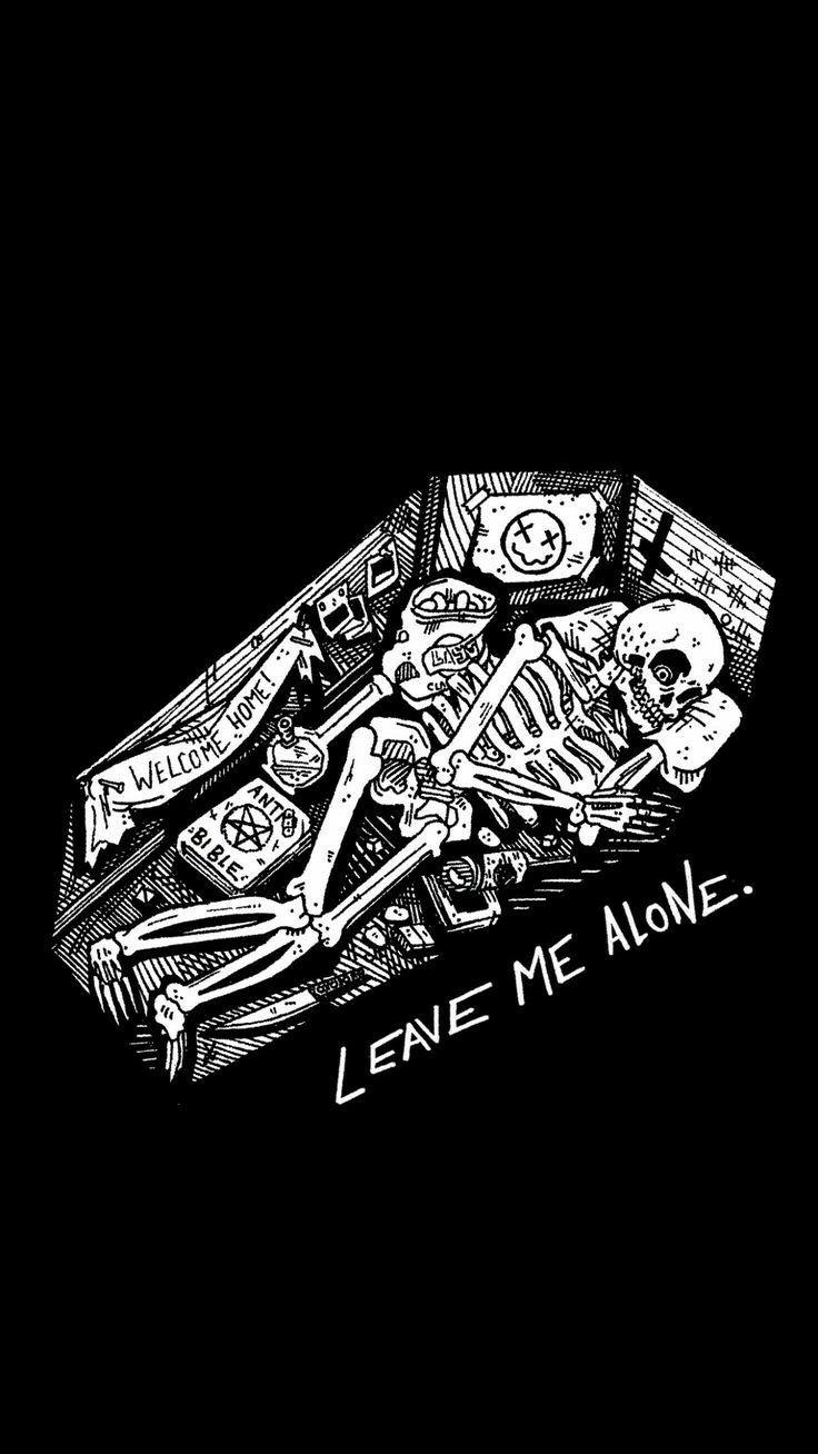 The skeleton is laying in a coffin with text that says len me alone - Gothic