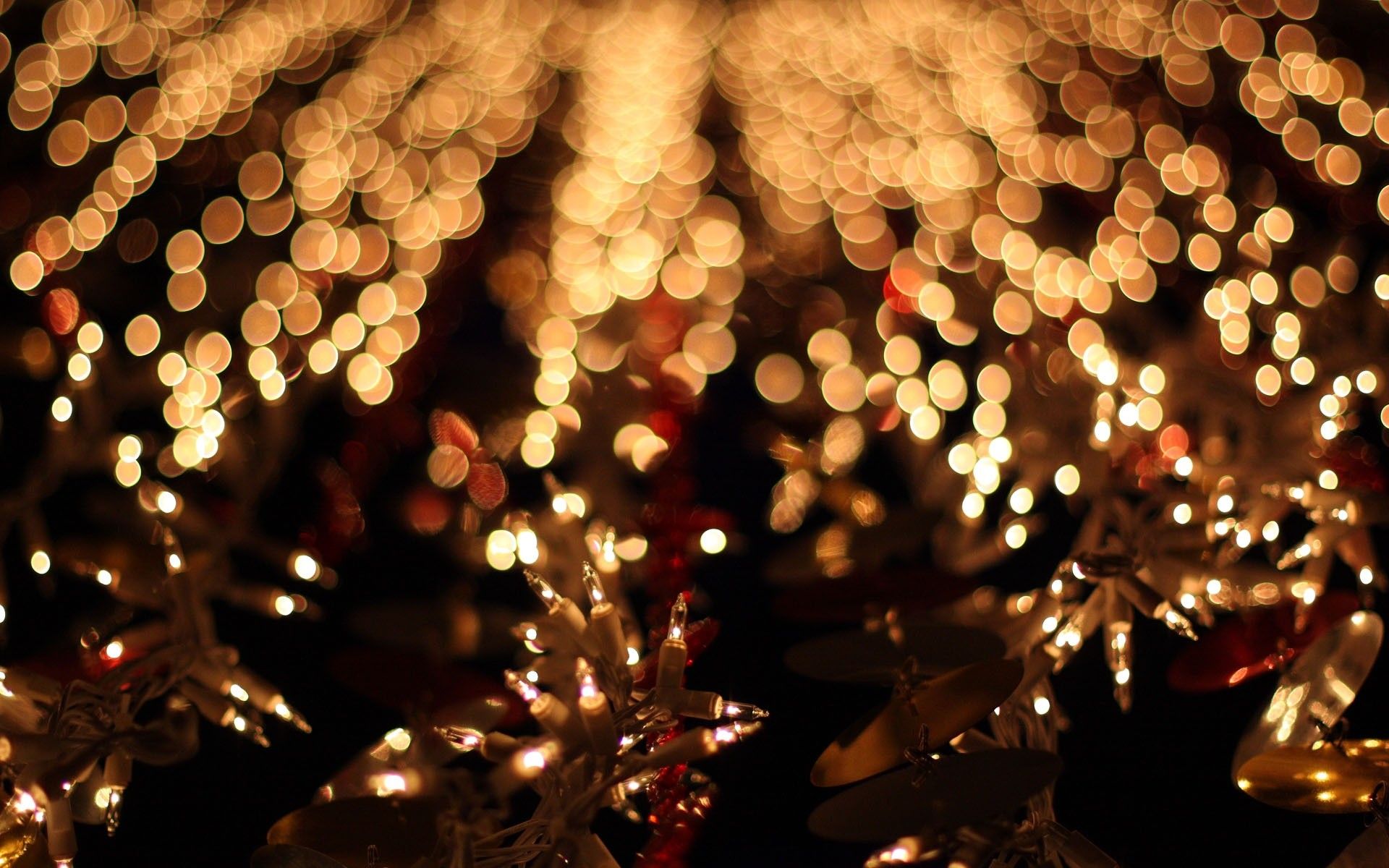 A string of lights on a dark background. - Christmas lights