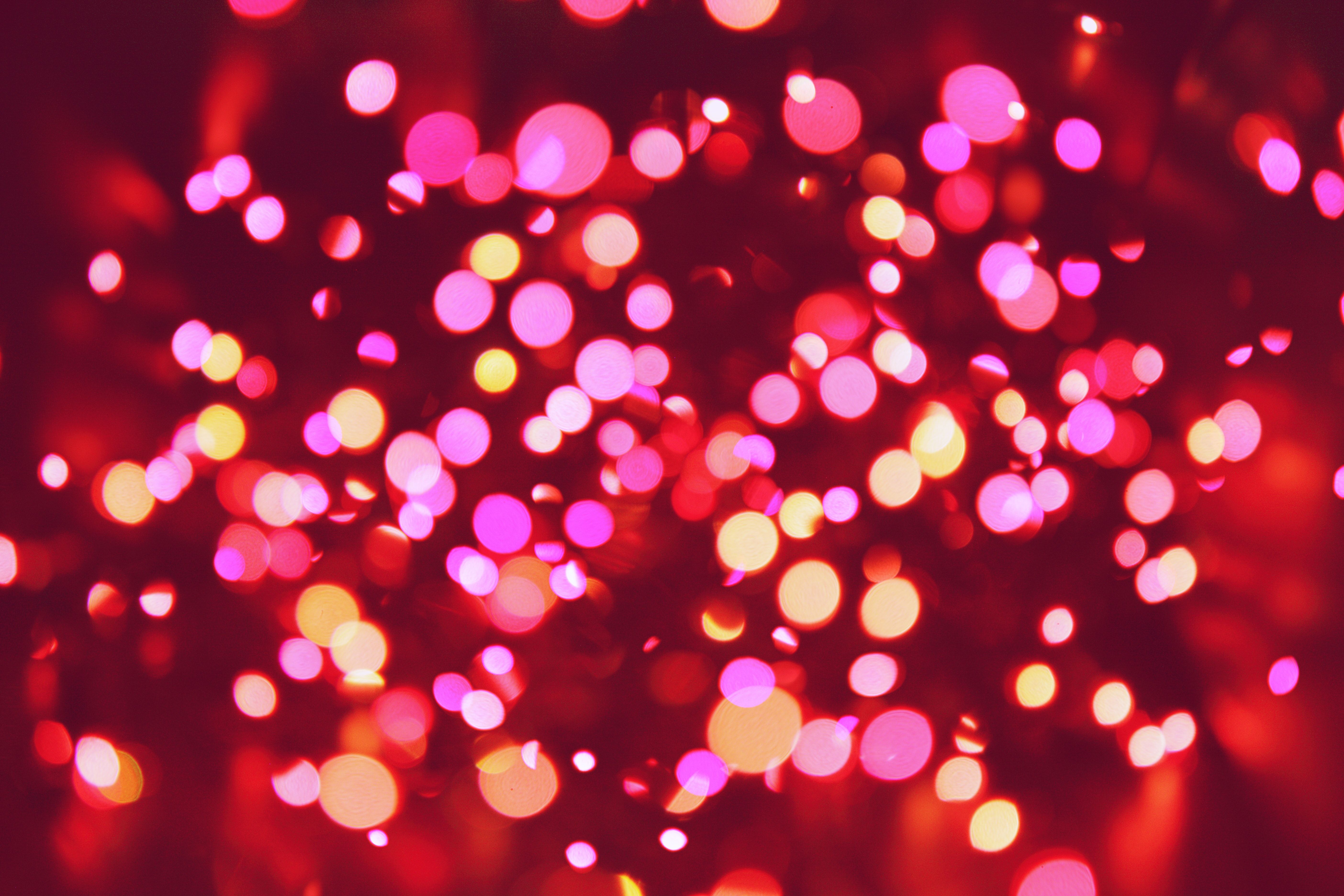 A red and pink bokeh background - Christmas lights