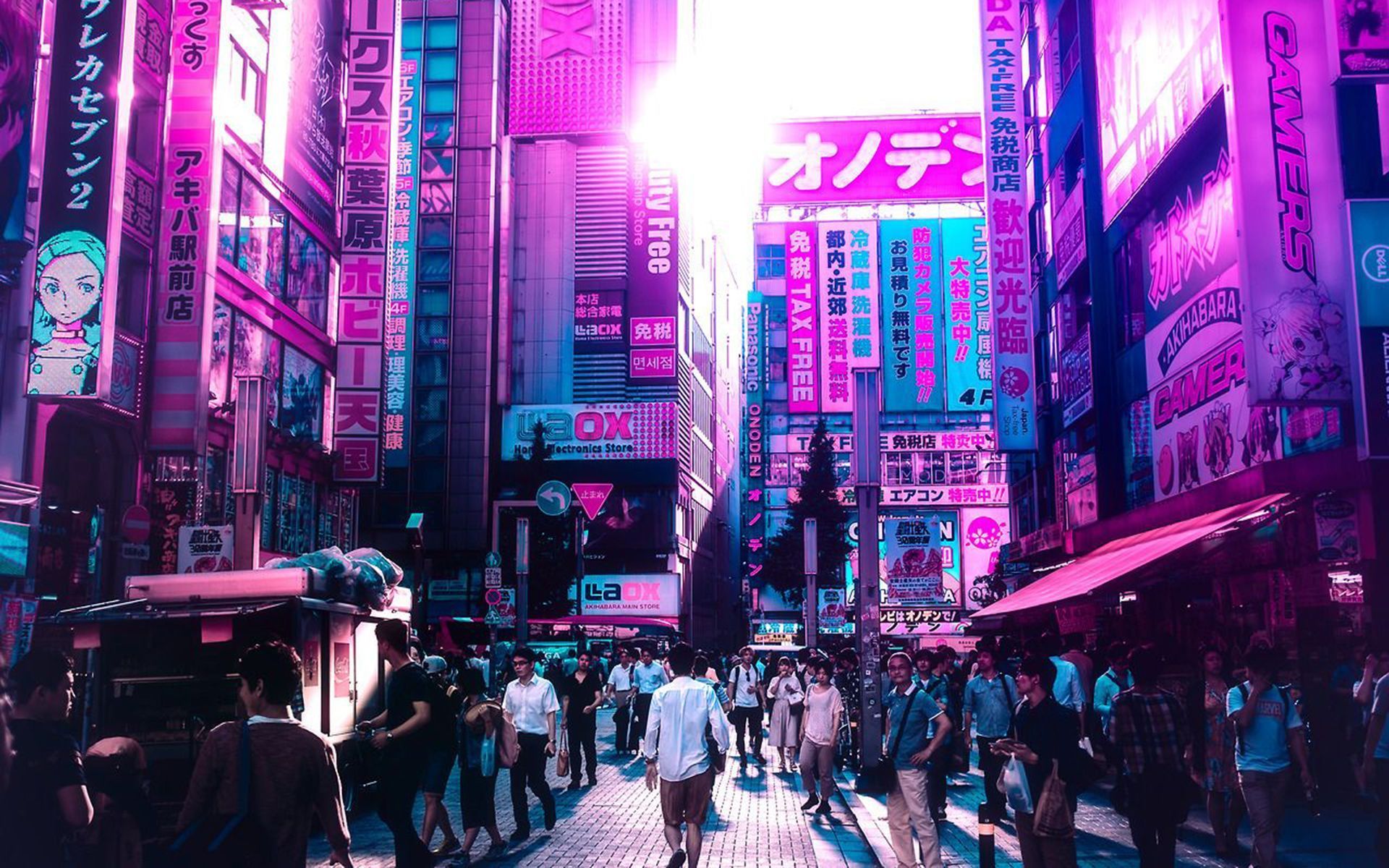 A busy street in Tokyo with people walking around and neon signs all around - Japan