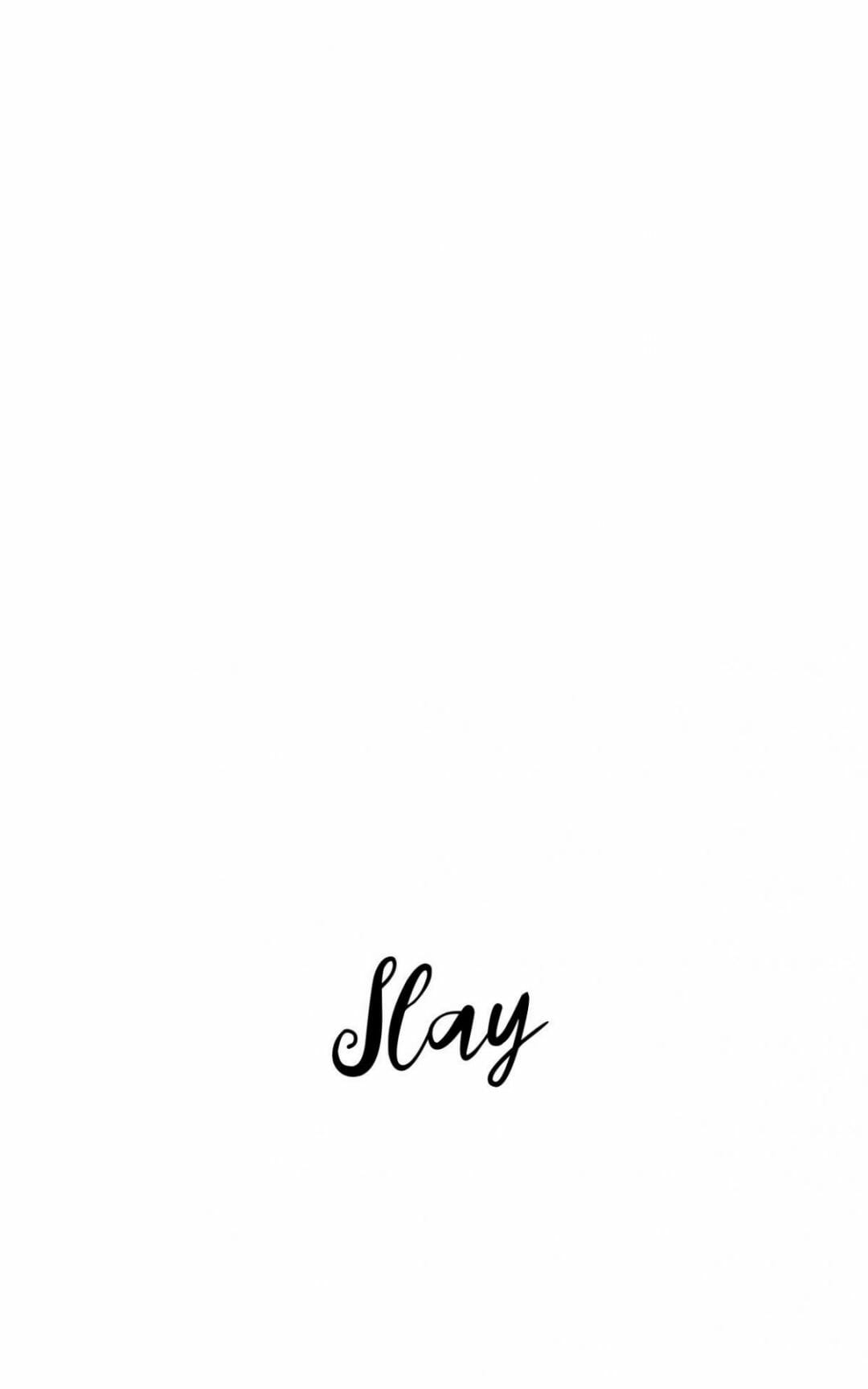A black and white photo of the word slay - White