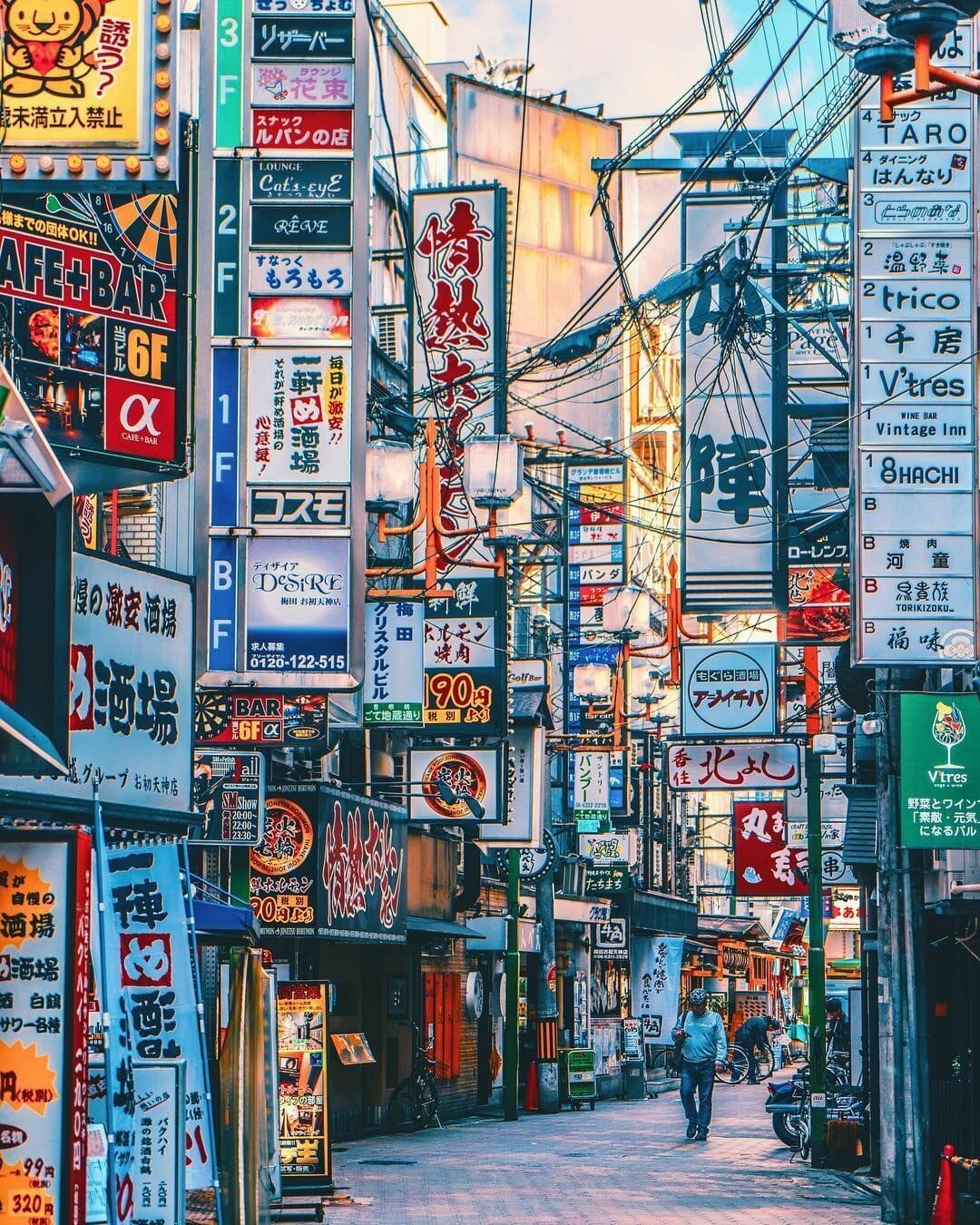 A busy street in Japan with many signs in the background. - Japan