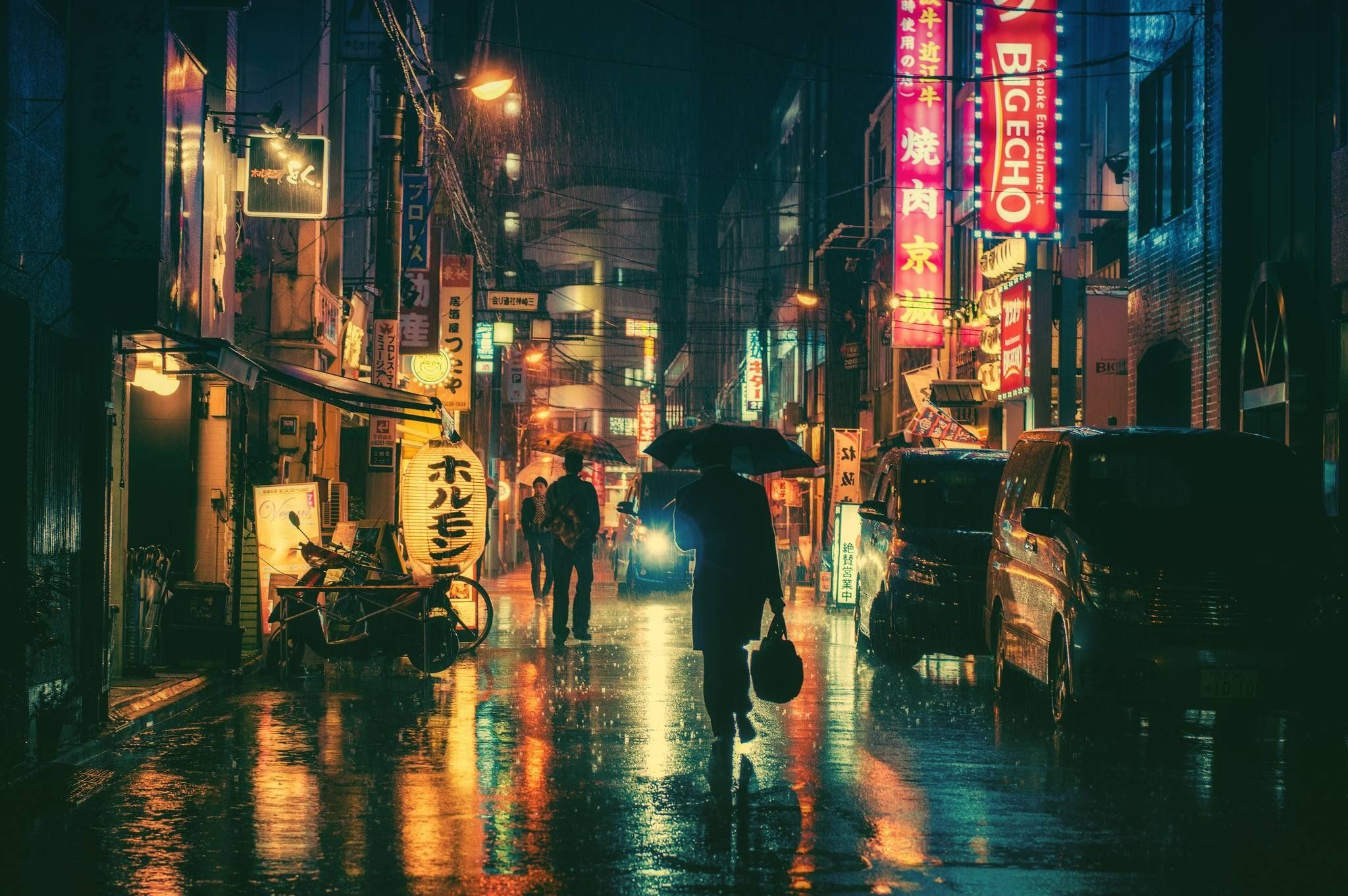 A person walking down the street at night - Japan, Tokyo