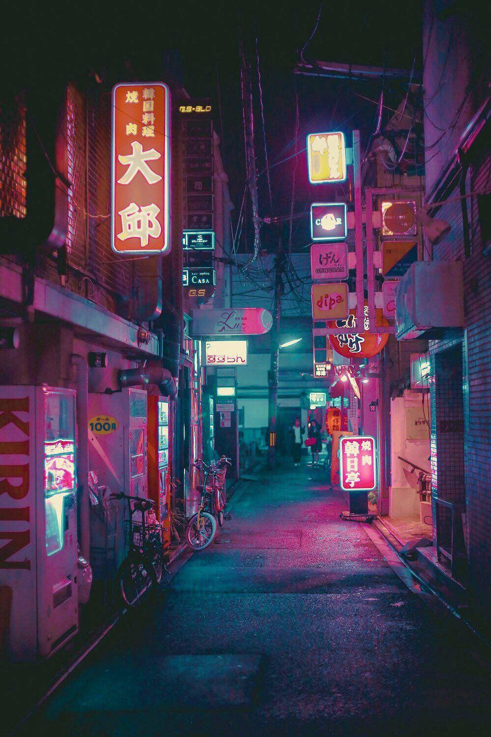 A street in Tokyo at night with neon signs - Japan