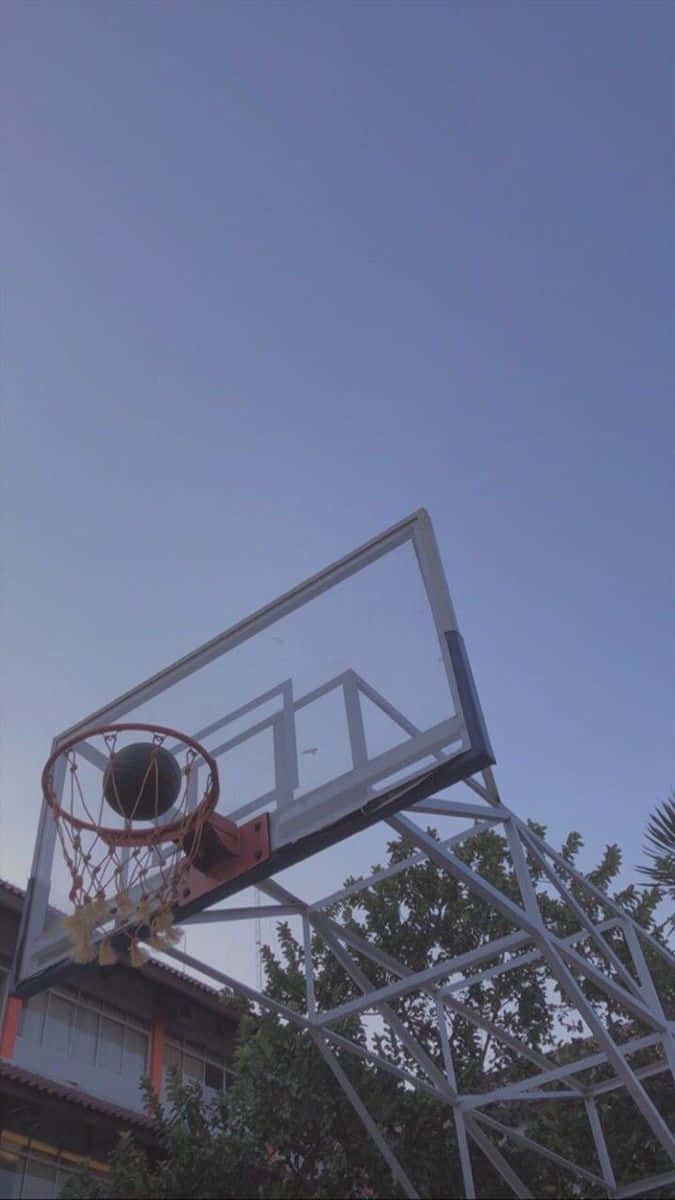 A basketball hoop with a sky background - Basketball