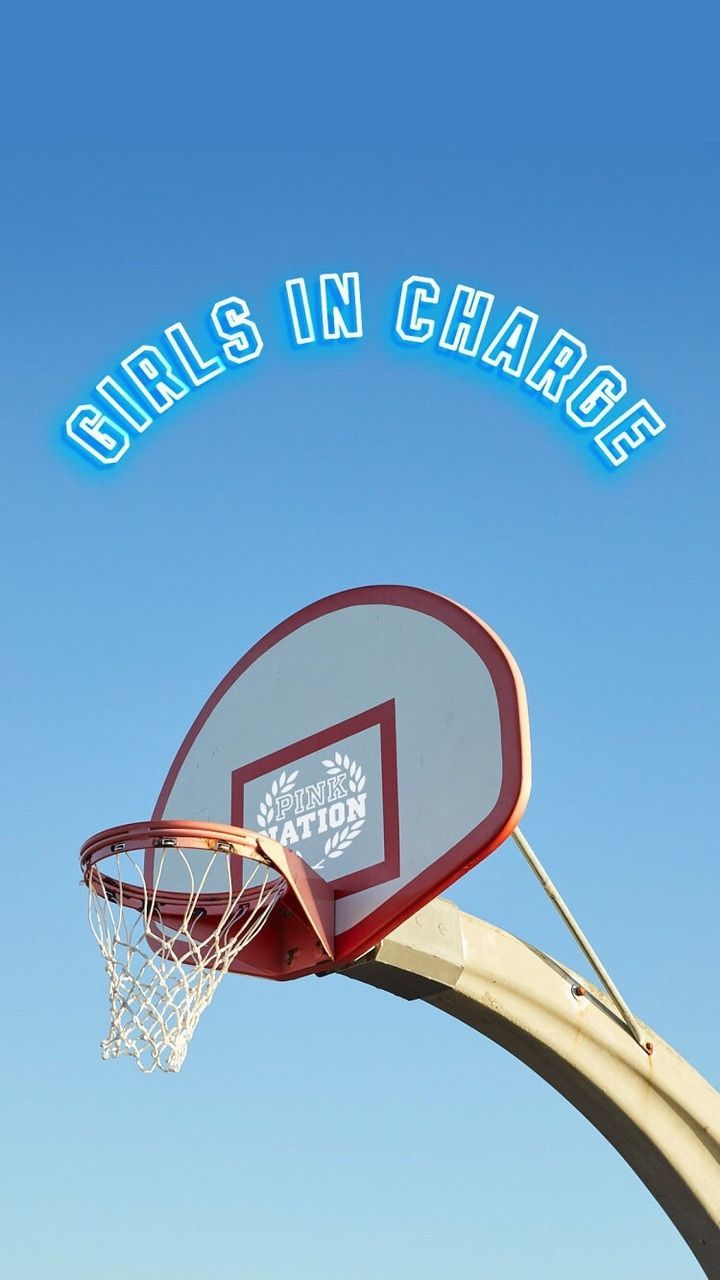 A basketball hoop with the words girls in charge above it - Basketball