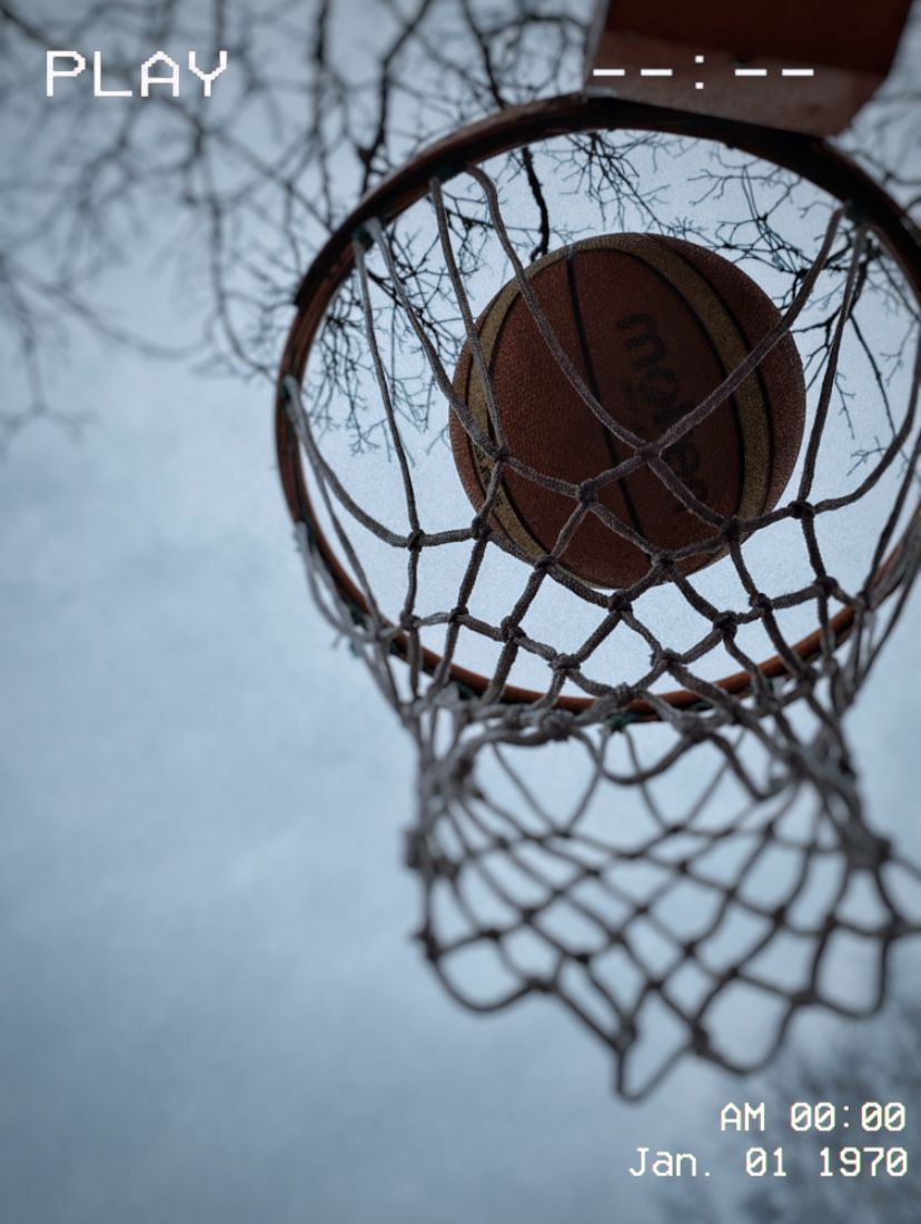 A basketball hoop with the ball in it - Basketball