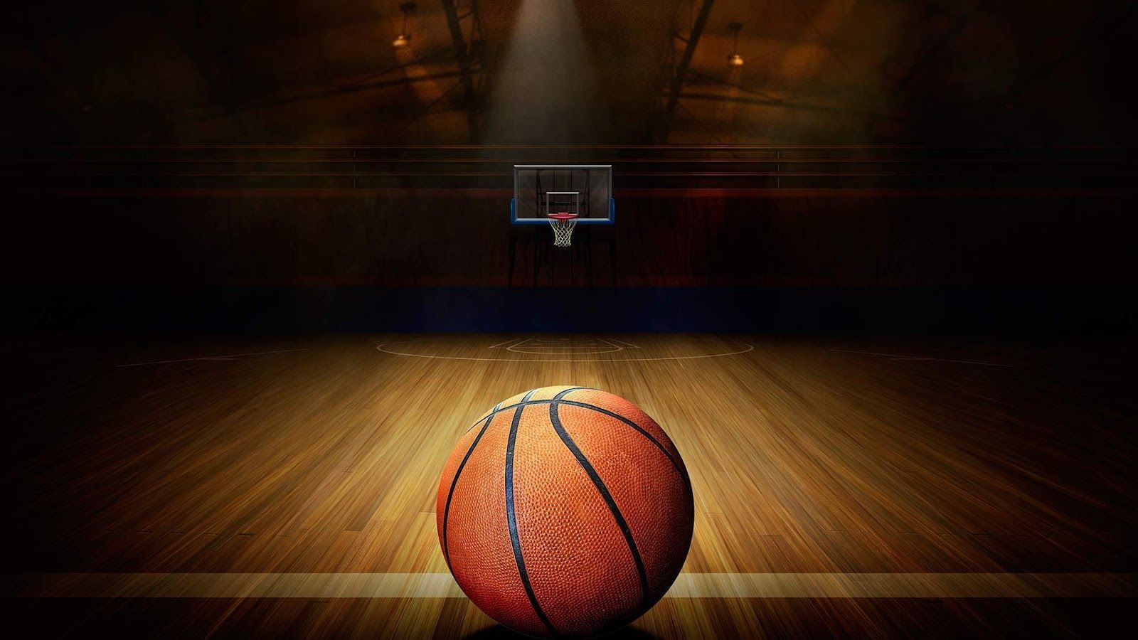 A basketball hoop and ball in an empty gym - Basketball