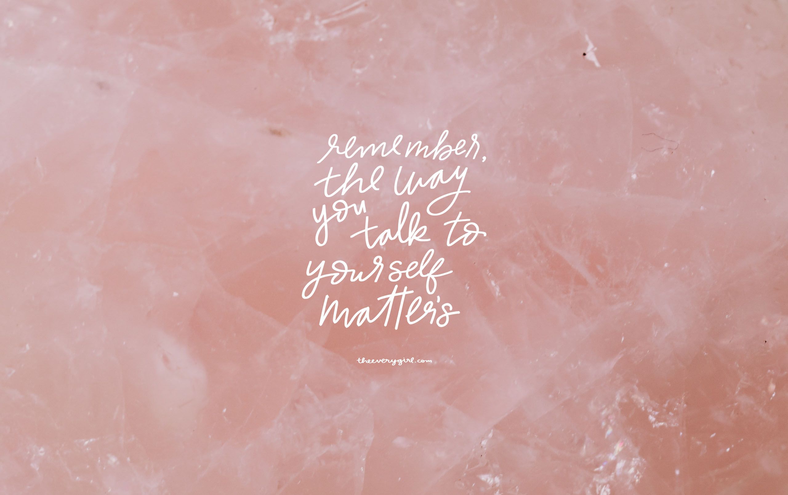 A quote on a pink crystal background that says 