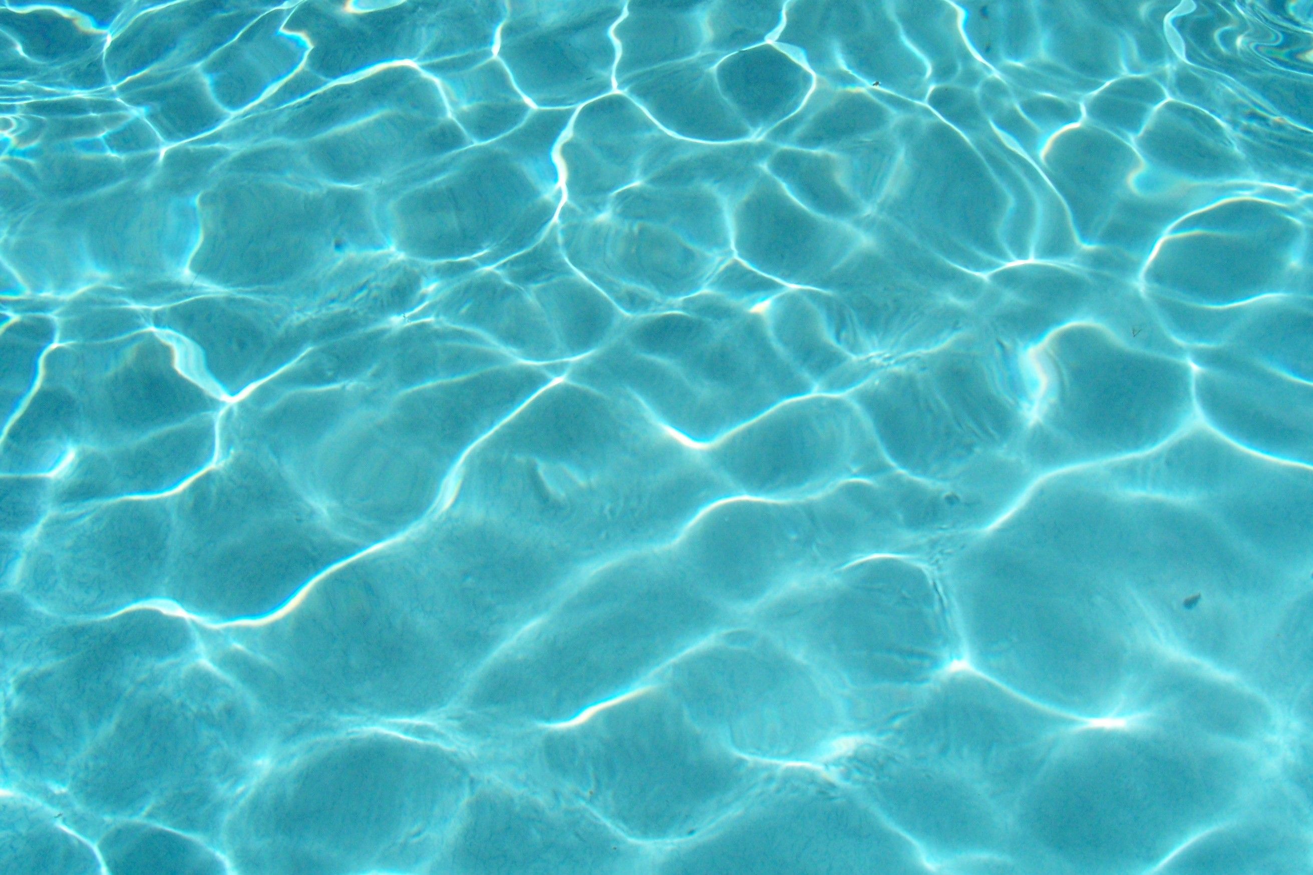 A close up of water in the pool - Water