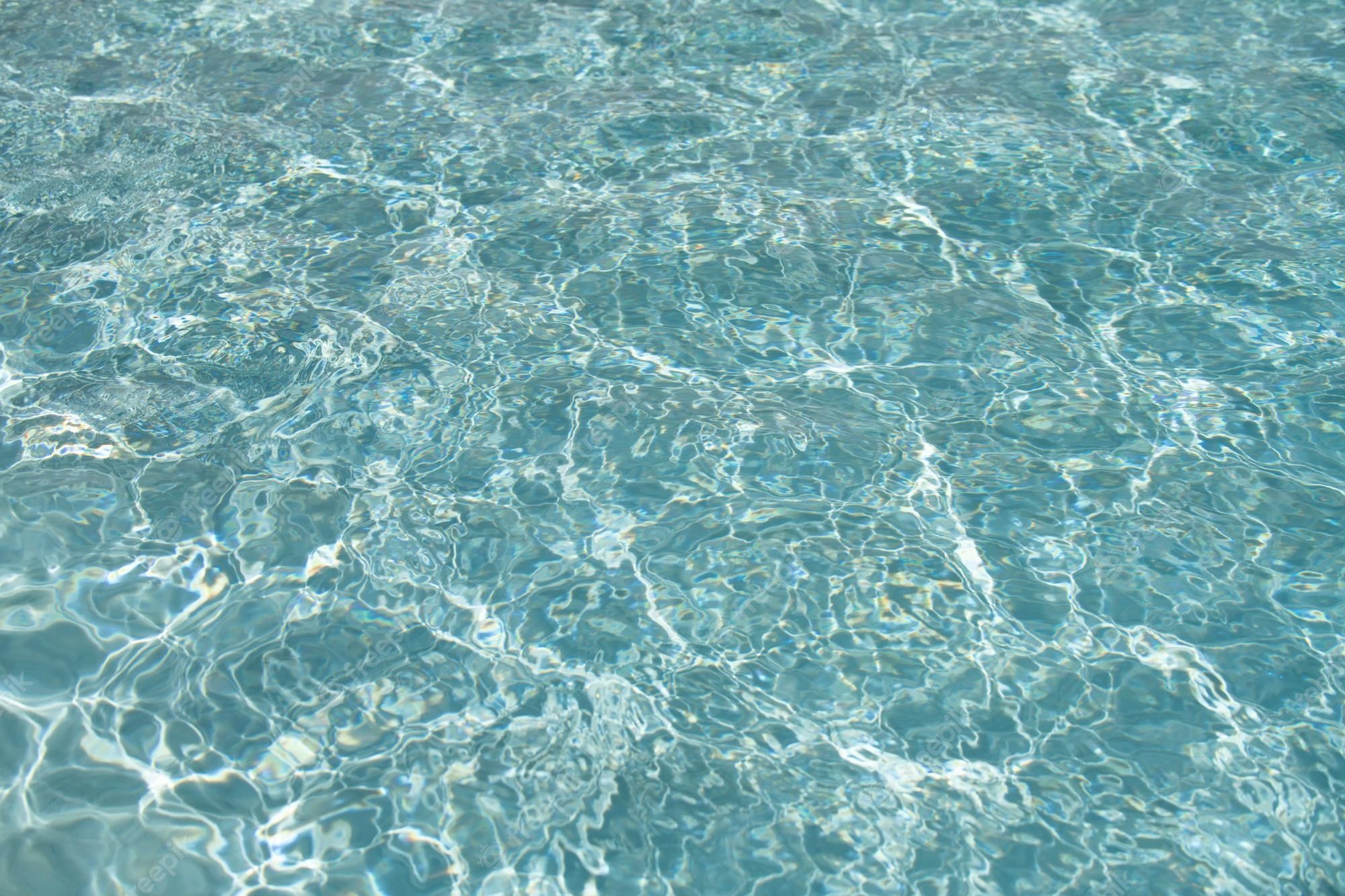 A pool of water with ripples and reflections - Water