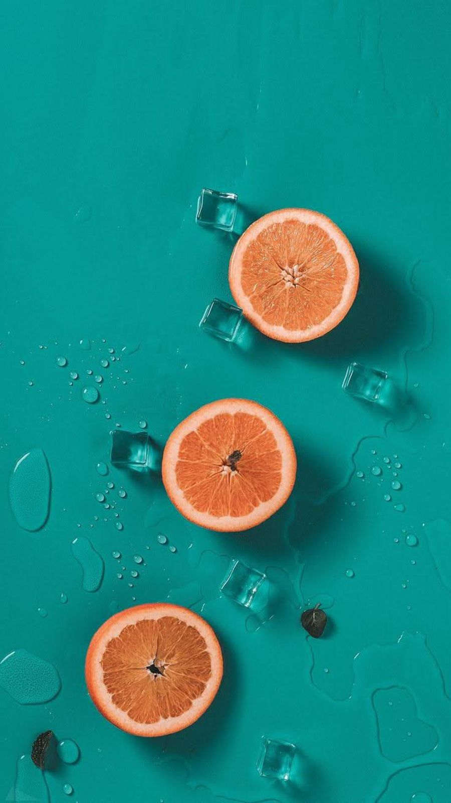 An iPhone wallpaper of sliced oranges on a blue background. - Foodie