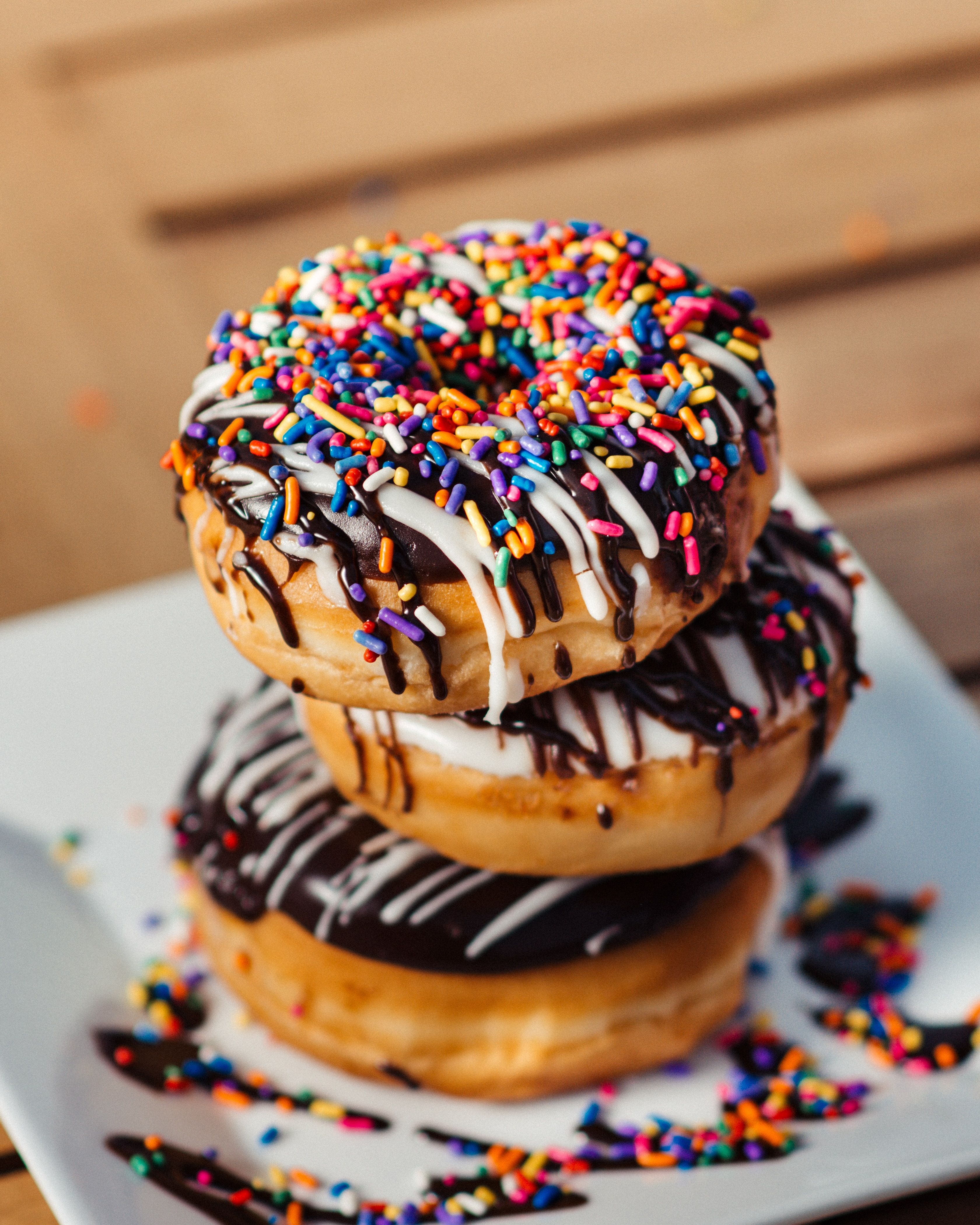 A stack of donuts with sprinkles on top - Bakery, foodie