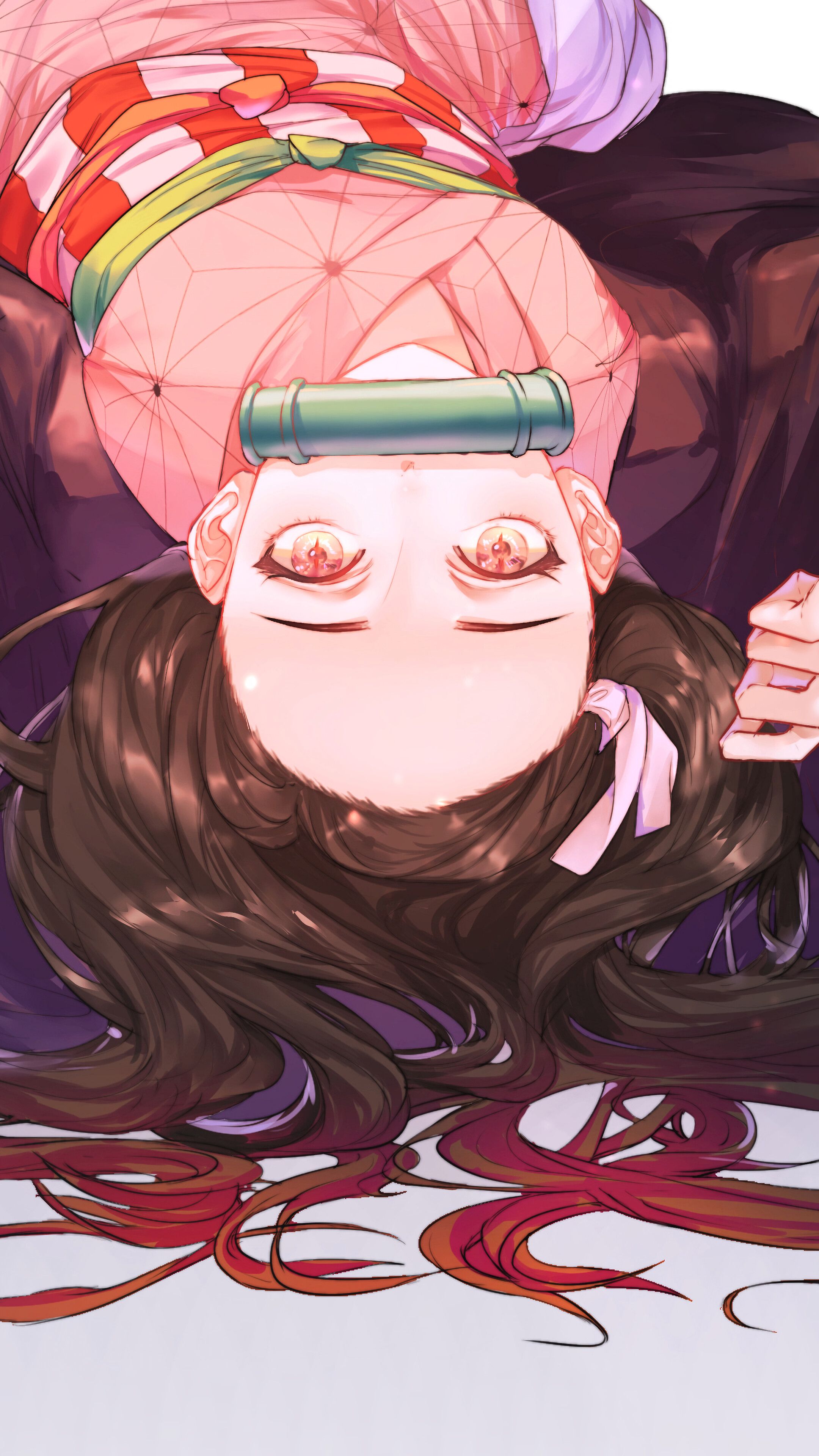 A woman laying on her back with long hair - Nezuko