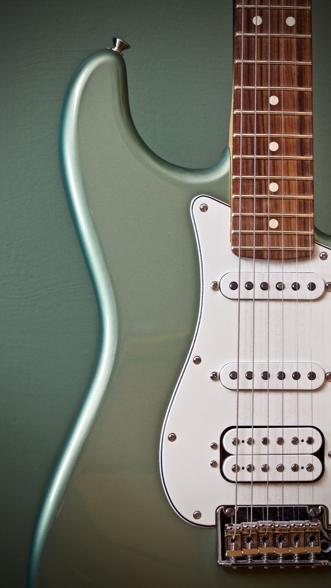 A close up of an electric guitar - Guitar