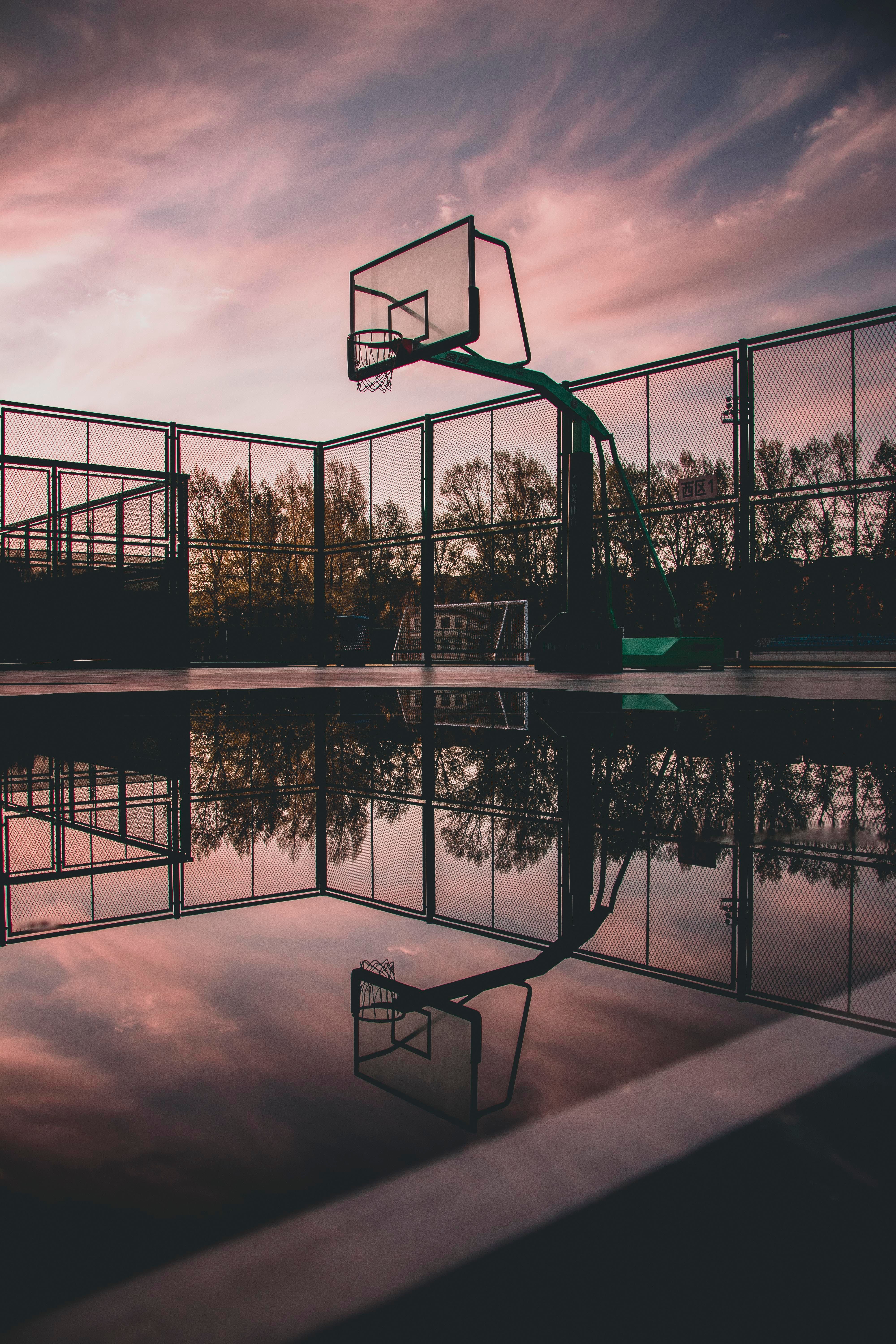 A basketball hoop is reflected in the water - Basketball