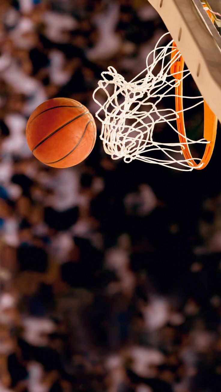 A basketball is going through the hoop - Basketball