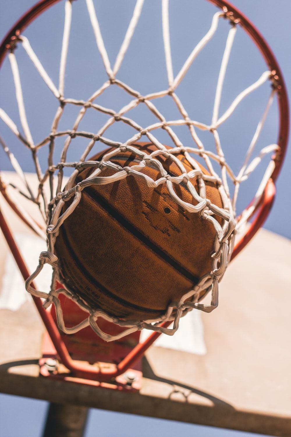 A basketball in a net - Basketball