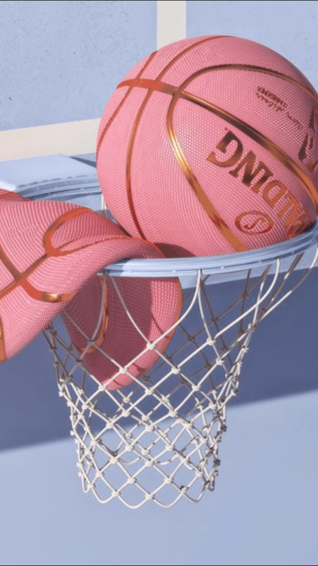 A pink basketball is sitting in the basket - Basketball