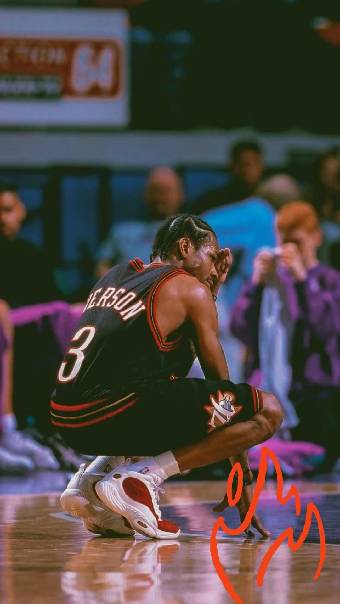 A man is kneeling on the floor of an arena - Basketball, NBA