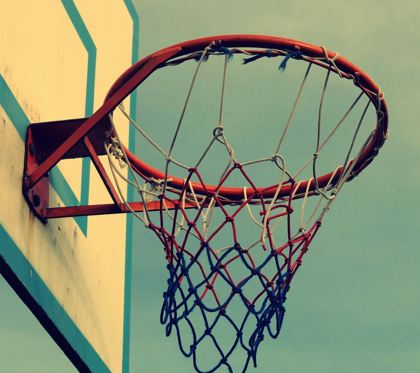 A basketball hoop with the net in it - Basketball
