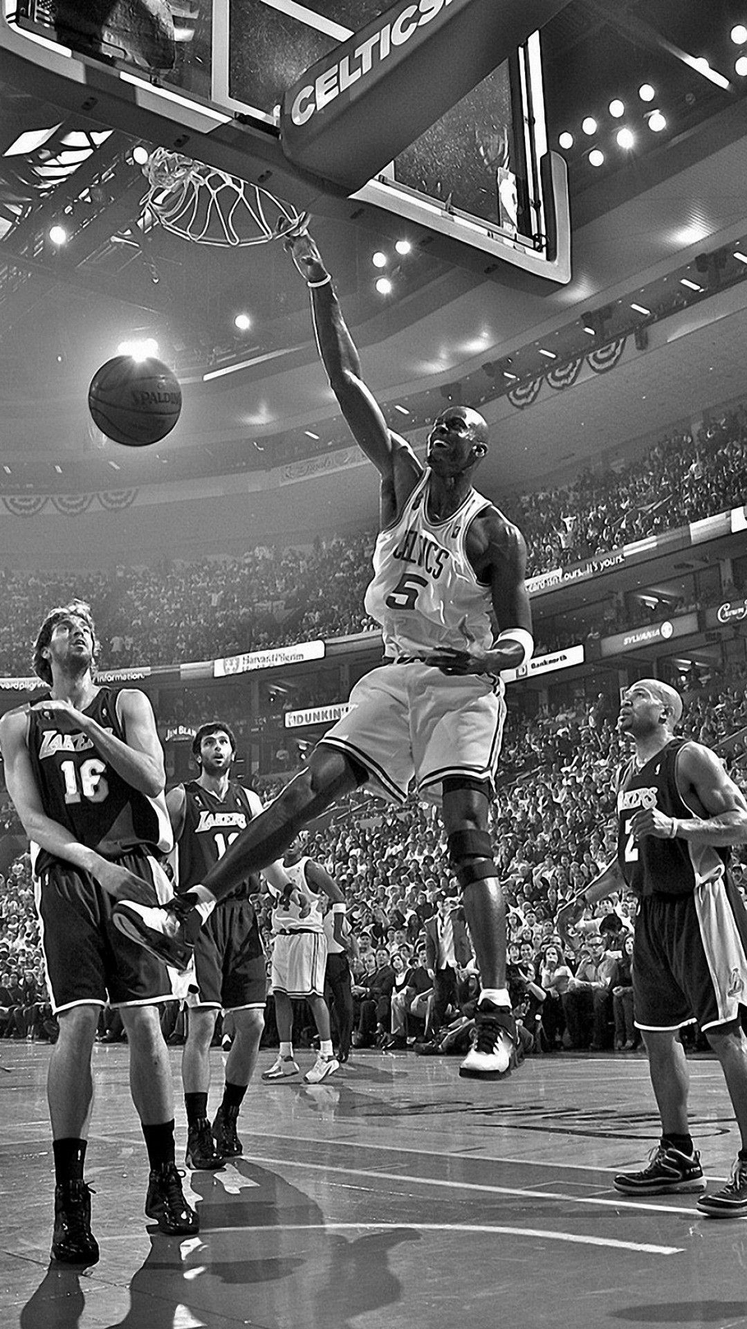 A basketball player in the air with the ball in his hand. - Basketball, NBA