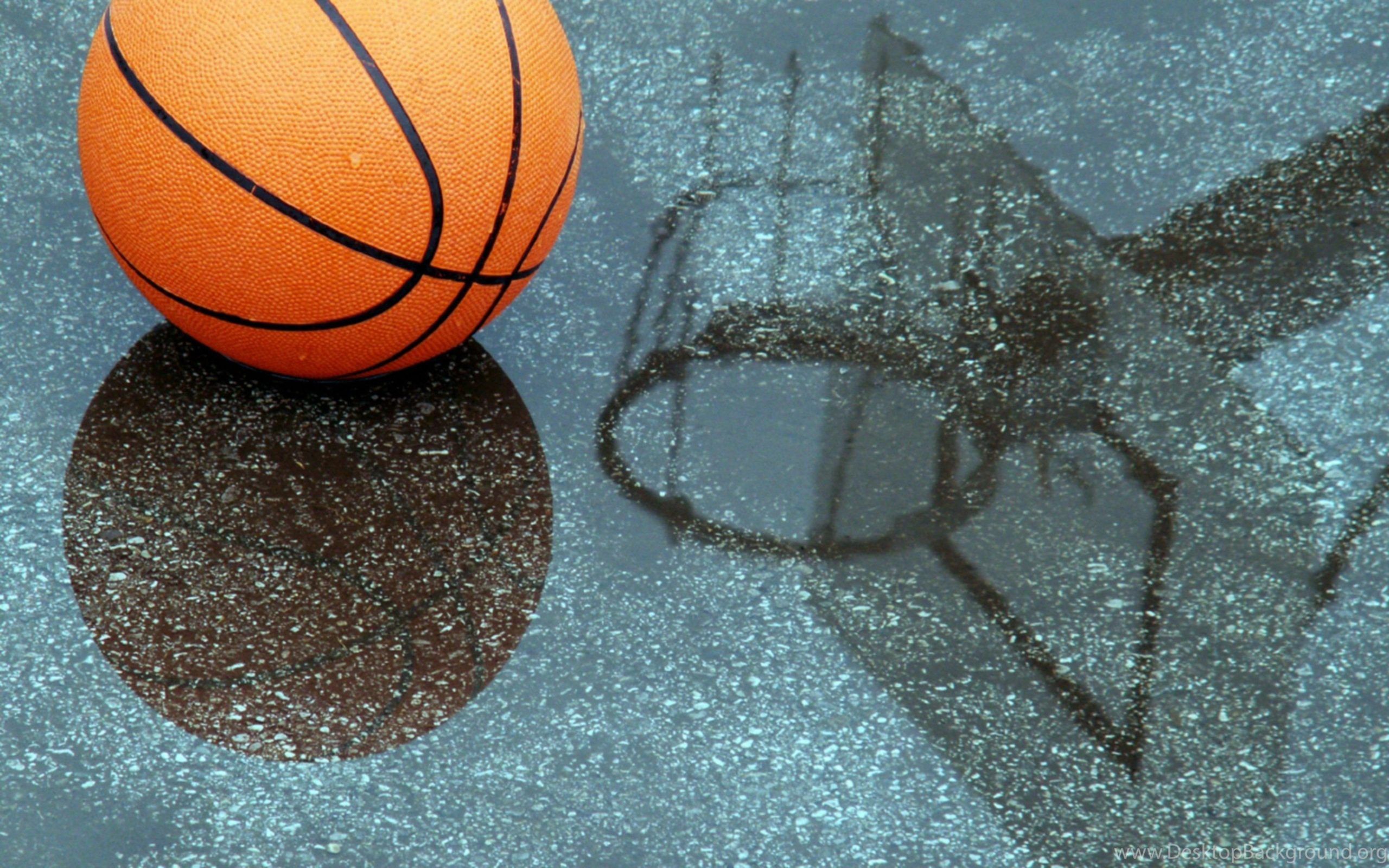 A basketball and ball are on the ground - Basketball