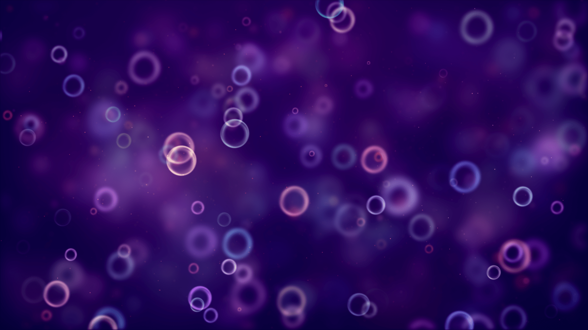 A purple abstract image with pink and blue bubbles. - Bubbles