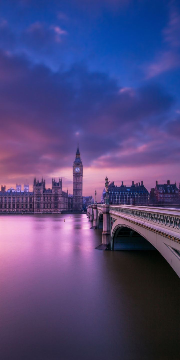 A bridge over water with buildings in the background - London